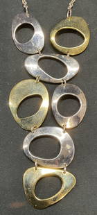 RLM Bronze Silver & Gold Tn Disc Pendant Necklace: Robert Lee Morris RLM silver tone necklace with silver and gold tone bronze disc pendants. Signed on pendant. Drop length approx. 10.5 inches. Pendant drop length approx. 4.25 inches. Some surface wea
