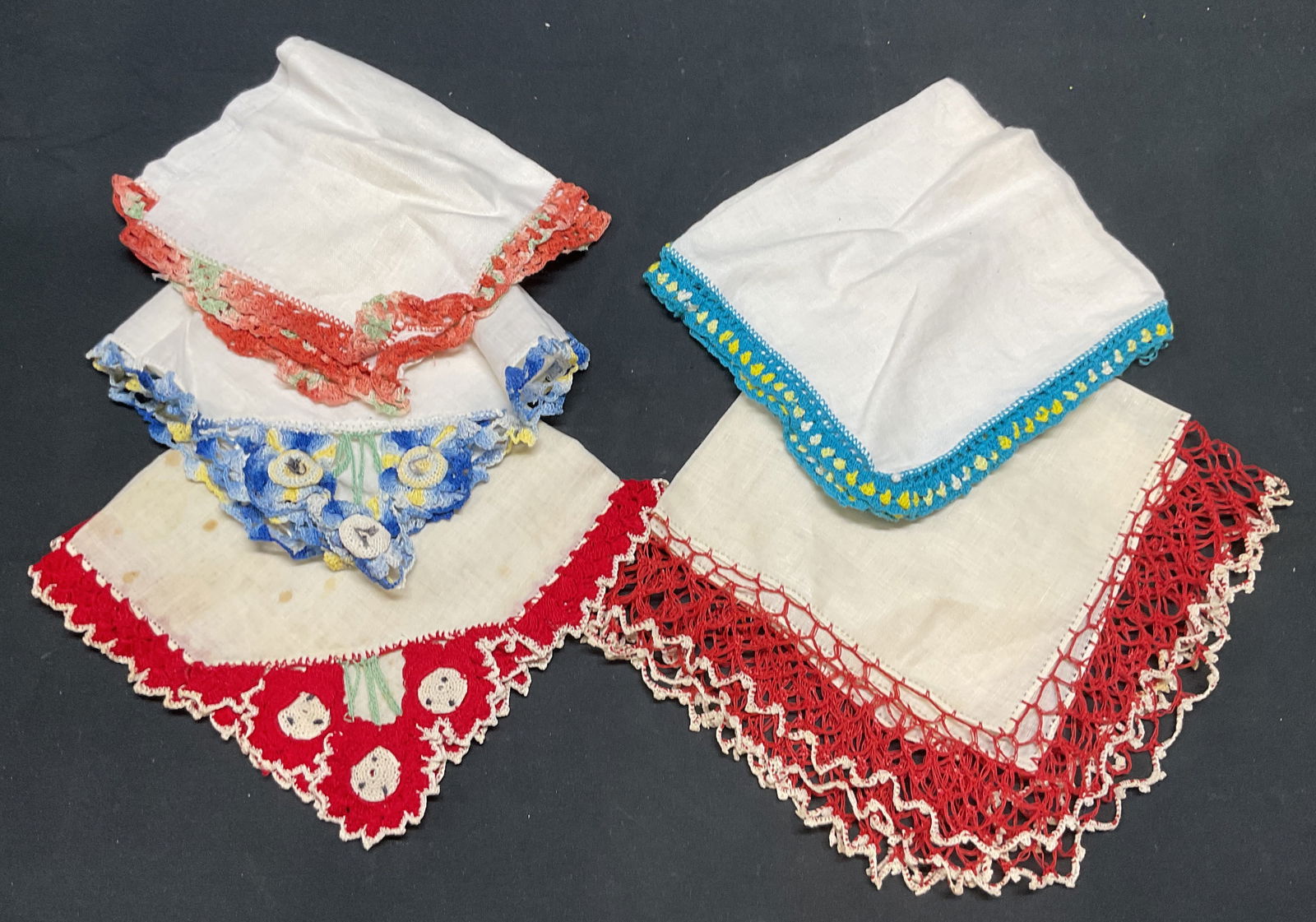 Lot 5 Vintage Red & Blue Lace Handkerchiefs: Lot of 5 vintage white cotton or linen handkerchief with red and blue lace trims. Largest piece measures approx. 14 x 14 inches. All pieces have wear to materials including blemishes and holes observe