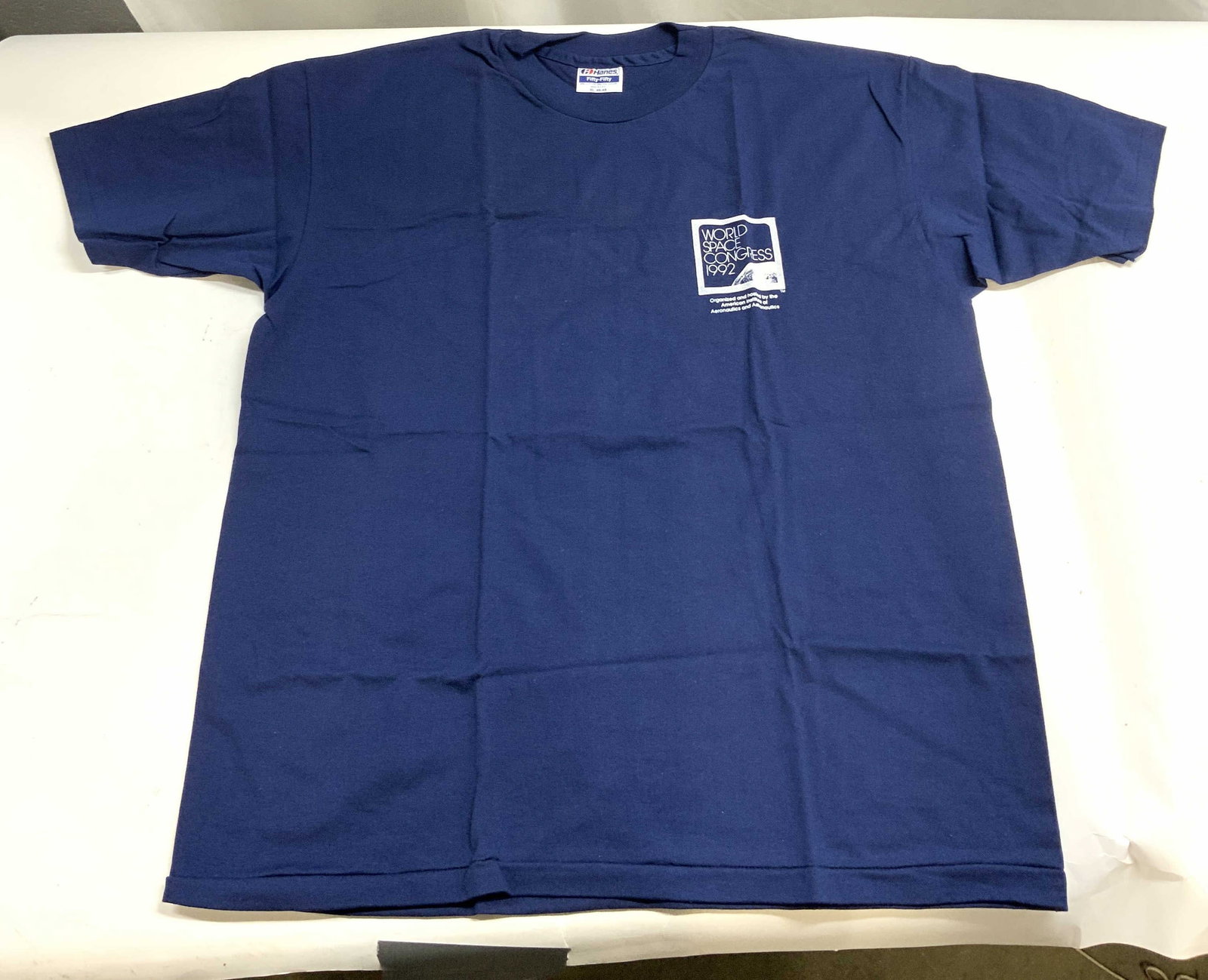 Vtg World Space Congress 1992 Hanes T-Shirt Sz XL: T-shirt is navy blue toned. Shirt reads World Space Congress 1992. Shirt is vintage. Tag reads HANES Fifty Fifty XL. Shirt is cotton & polyester as reads on tag. Measures approximately 28 inches tall