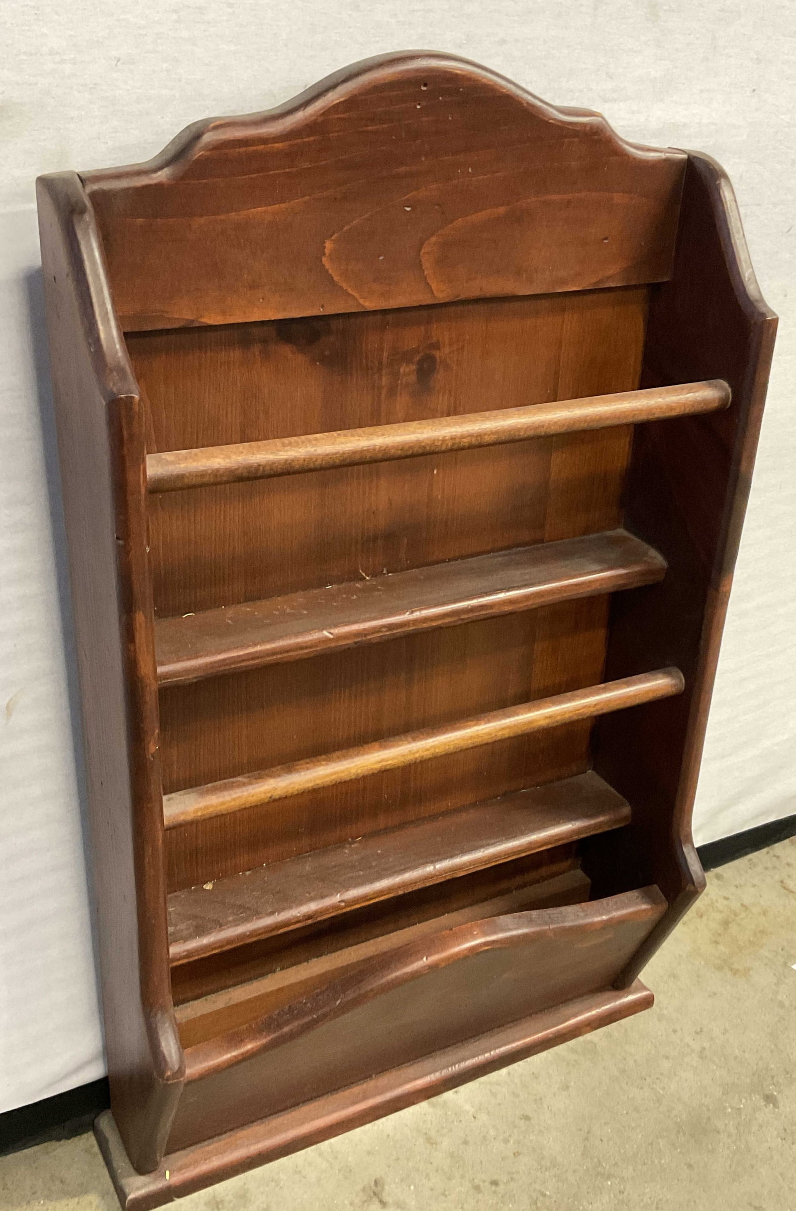Vintage Wooden Wall Shelf / Floor Shelf: A vintage brown hued wooden wall shelf / floor shelf. Metal hardware to reverse for wall display. Measures approx. 16W x 4D x 28H in. Surface wear consistent with age, use, and exposure. Woodwork, vin