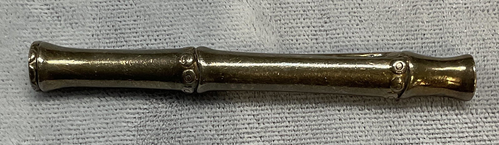 Vintage Signed Sterling Silver Bamboo Brooch: Vintage signed sterling silver bamboo motif brooch. Signed H on side. Pull release hinge pin on side. Made in Indonesia. Marked 925. Measures approx. 2.25 inches long. Total weight .24 ozt. Some surfa