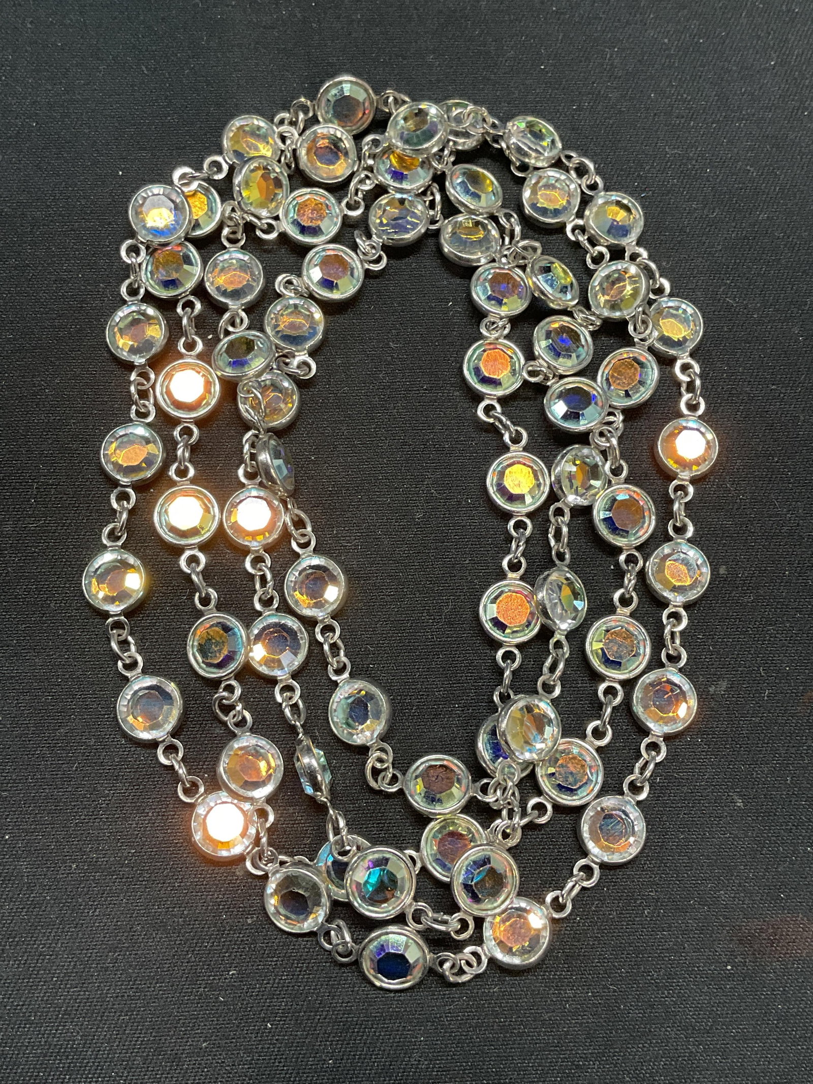 Vintage Silver Tone Crystal Necklace: Vintage silver tone chain necklace with colorless crystal decoration. Drop length approx. 18 inches. Some surface wear including scratching observed. Jewelry, estate jewelry, costume jewelry, cocktail