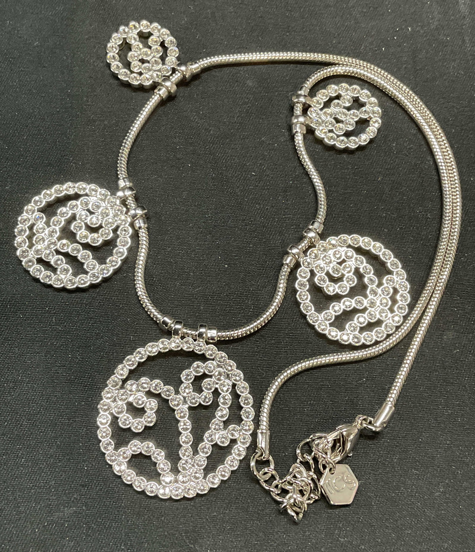 Swarovski Touchstone Crystal Pendant Necklace: Touchstone by Swarovski silver tone Swarovski crystal pendant necklace. Signed TCS on hang tag. Drop length approx. 8.5 inches. Some surface wear including scratching observed. Jewelry, estate jewelry