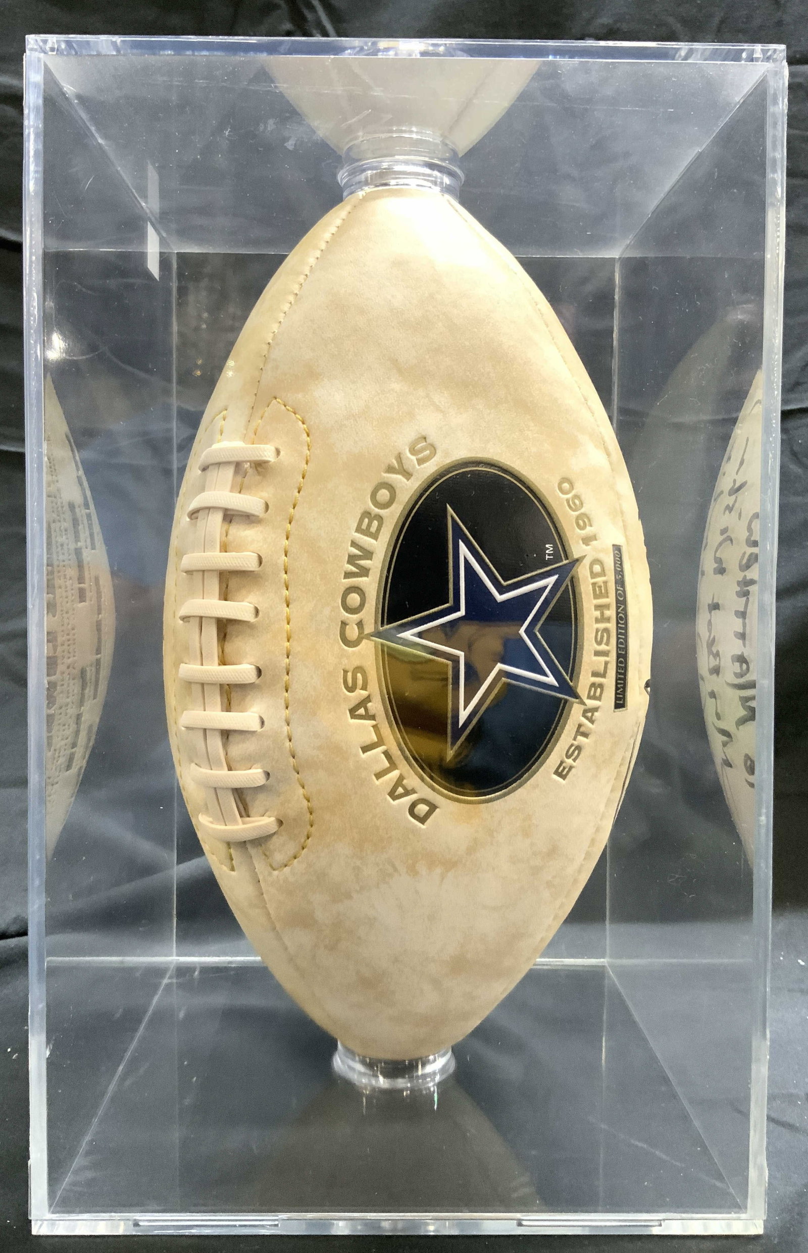 Signed DALLAS COWBOYS Ltd Ed Football In Case: Football is signed TO MATTHEW BEST WISHES, with illegible signature. Football is cream and brown toned. Football is inside acrylic case. Piece has DALLAS COWBOY star logo & reads LIMITED EDITION OF 5,