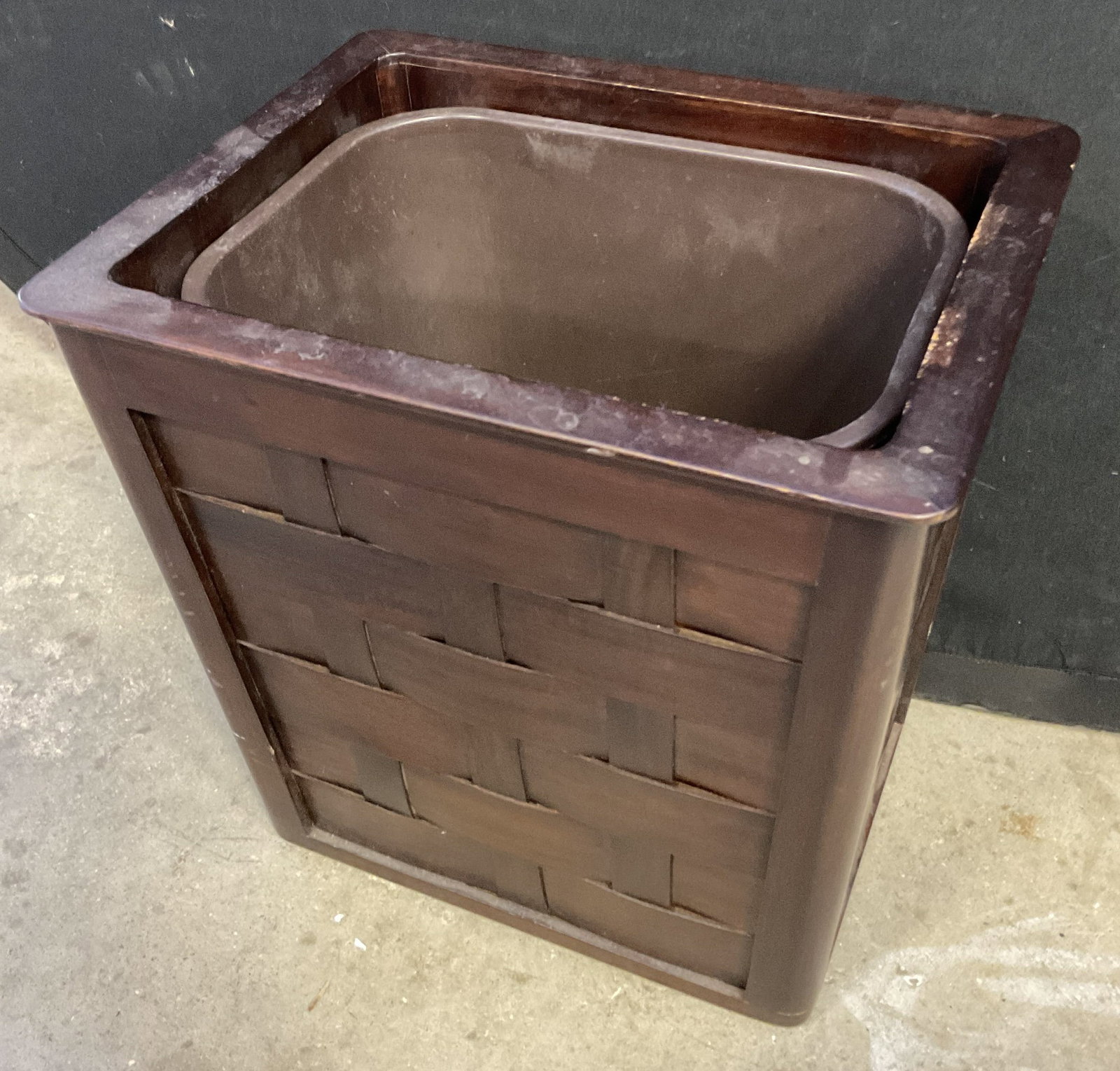 SELAMAT DESIGNS Woven Wood Motif Receptacle Bin: A wooden receptacle bin featuring a woven veneer / faux wood material design. Sticker to underside reads SELAMAT DESIGNS. Measures approx. 13.25H x 13.25W x 10.5D in. Comes with a removable plastic bi