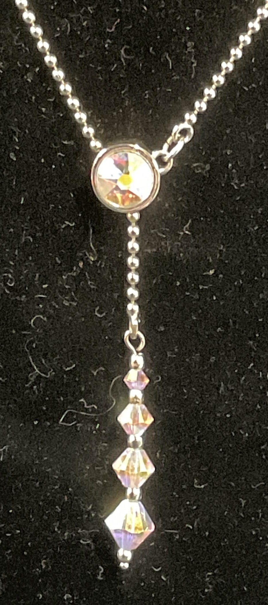 Swarovski Touchstone Crystal Pendant Necklace: Touchstone by Swarovski silver tone pendant necklace with Swarovski crystal decoration. Signed on hang tag. Drop length approx. 9 inches. Some surface wear including scratching observed. Jewelry, esta