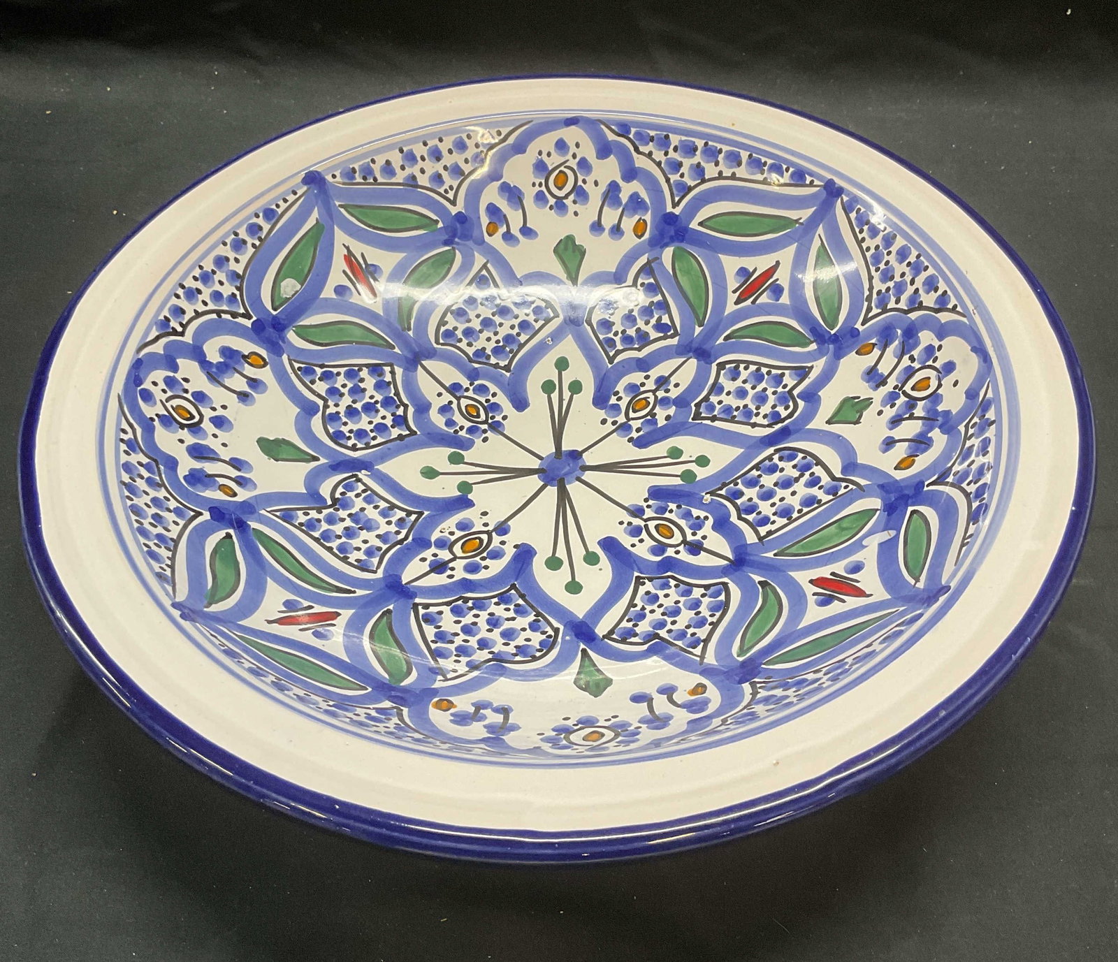 Vintage Art Pottery Floral Bowl, Tunisia: Vintage art pottery bowl. Floral motif in blue and green. Hand painted. Made in Tunisia. Measures approx. 13 x 3 inches. Some surface wear including scratching observed. Bowl, art pottery bowl, cerami