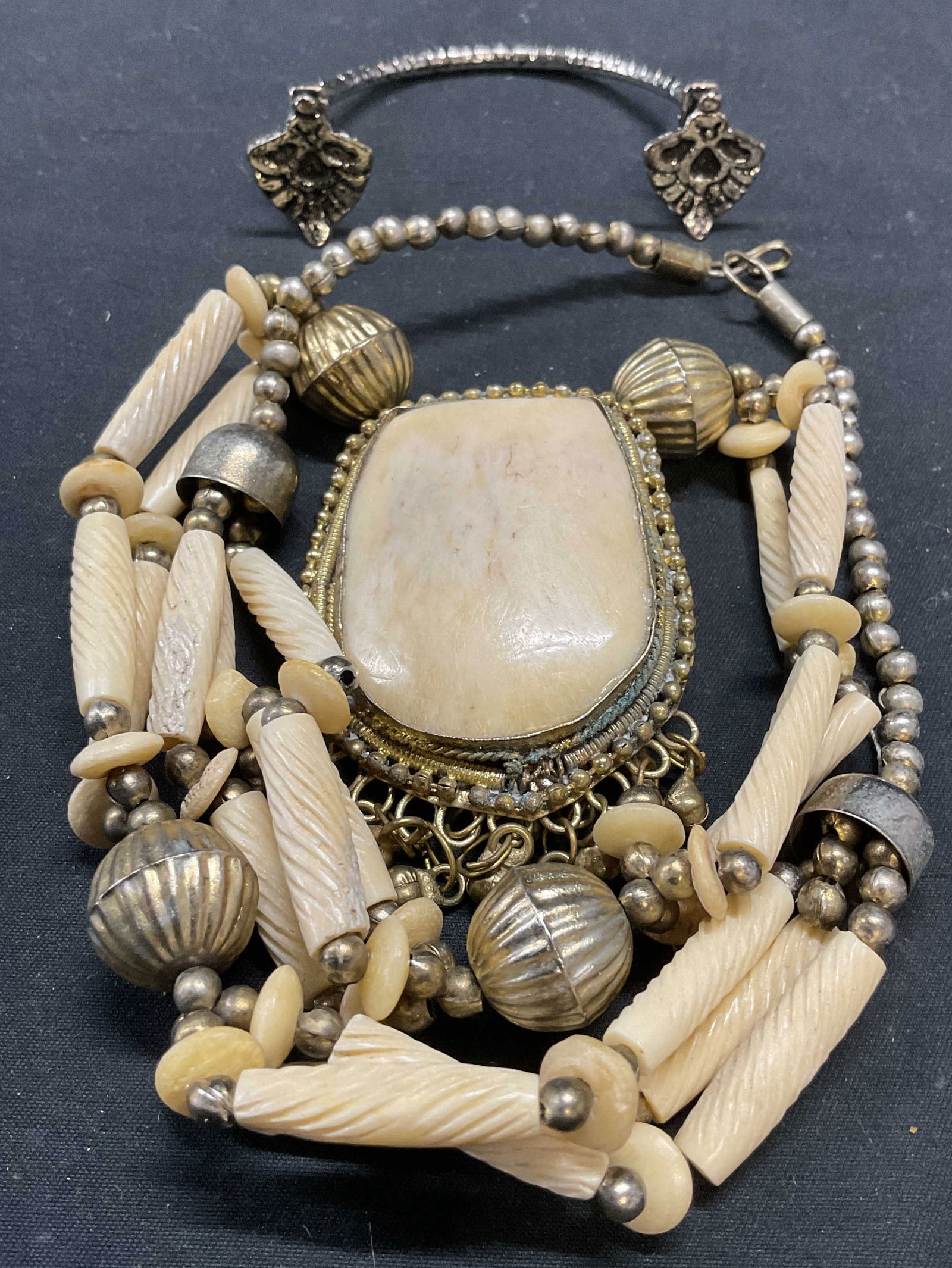 Lot 2 Silver Tn Bone Pendant Necklace, Cuff: Lot of 2 jewelry pieces. Silver tone cuff bracelet. Measures approx. 2 inches wide. Silver and gold tone and bone beaded pendant necklace. Drop length approx. 10.5 inches. Pendant measures approx. 2.5