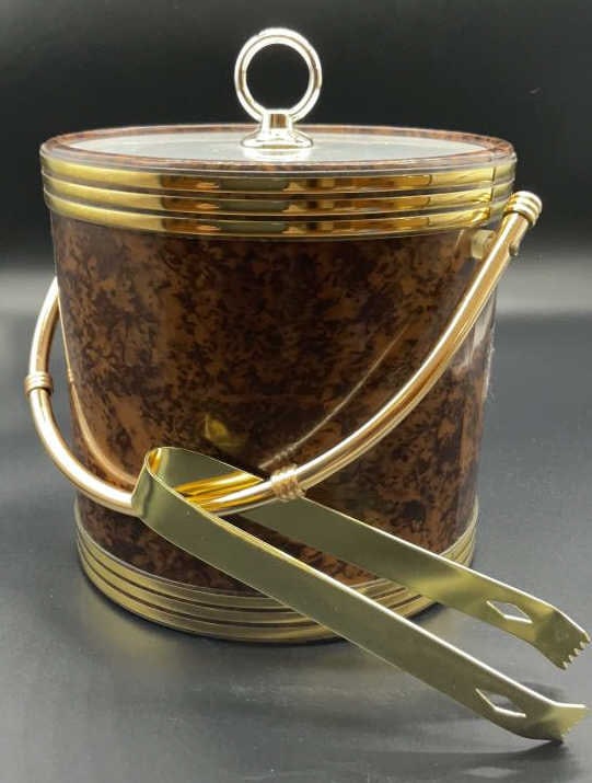 Vintage Brass Acrylic and leatherette ice bucket: Cylindrical ice bucket in black and brown marbleized style leatherette with brass banding at top and at base, brass tubular handle, brass tongs, and acrylic top with silver toned ring, vintage bar acc