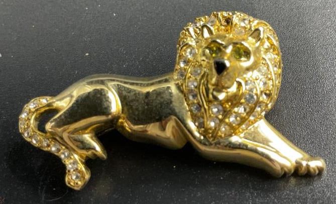 MONET gold tone Crystal Lion Brooch Pin: Vintage designer jewelry, Monet lion, gold toned with crystal eyes , mane and tail, vintage jewelry, estate jewelry, measures length app 2 inches by 1.5 inches