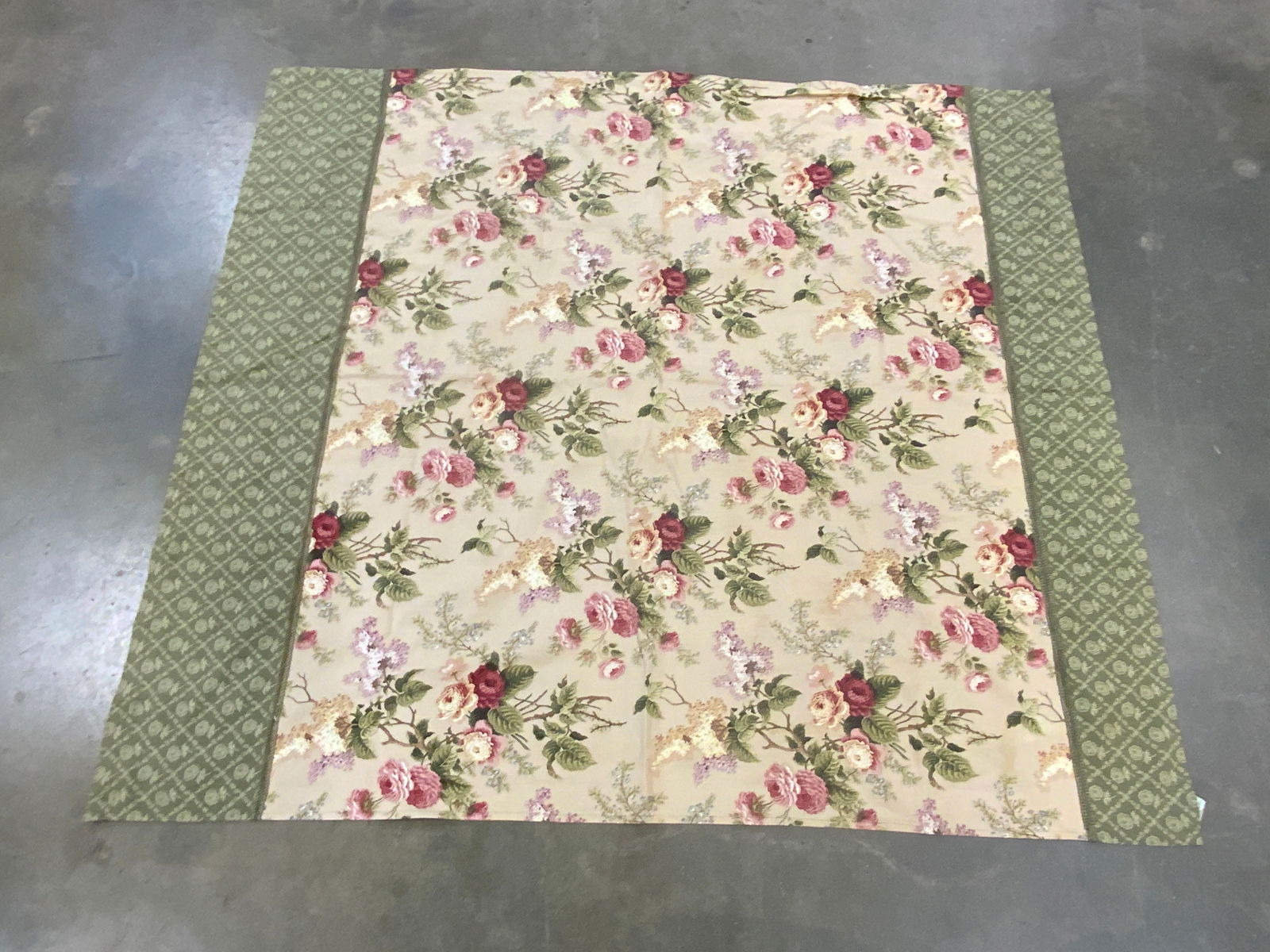 WAVERLY Vintage 100% Cotton Floral Tablecloth: A vintage floral motif tablecloth. Multicolored hues. Tag affixed to reverse reads WAVERLY, 100% COTTON, MADE IN PAKISTAN. Measures approx. 64L x 72W in. Discoloration, pulls to fabric, and surface we