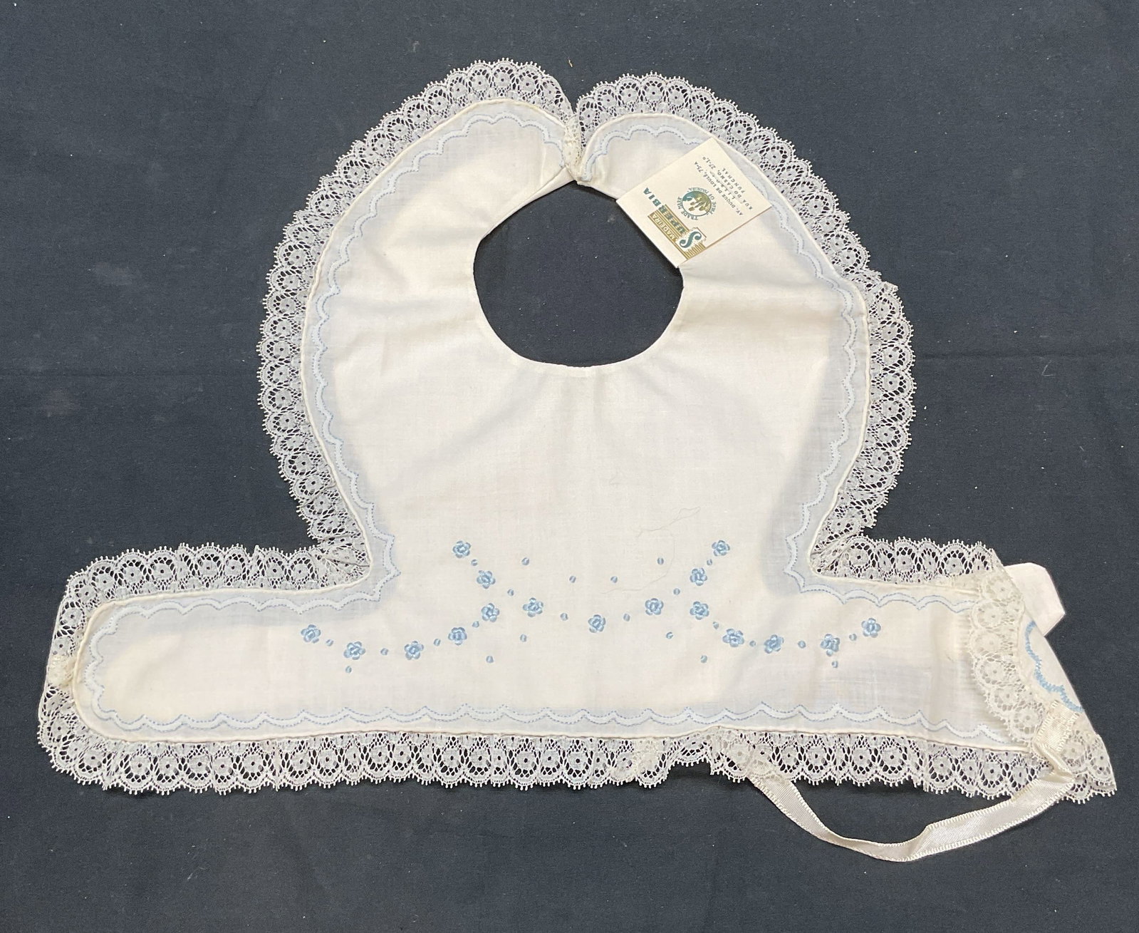 Lot 2 Superbia Lace Baby Bibs, Madeira NWT: Lot of 2 vintage Superbia white baby bis with lace trim and pink and blue embroidered detail. New with tags. Made in Madeira. Material feels like cotton. Measure approx. 9 x 13 inches each. Includes b