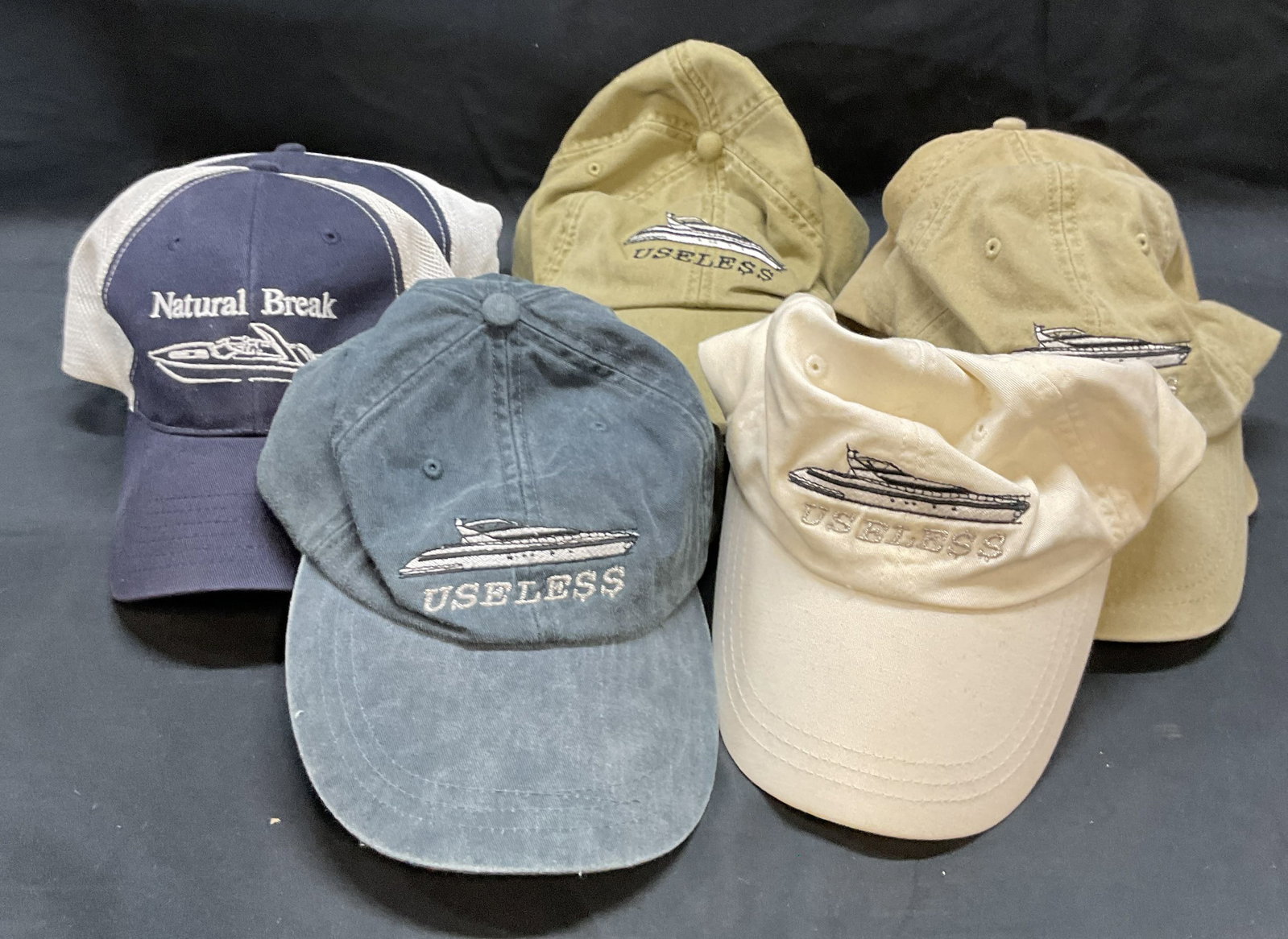 Group 8 Adams Cotton Boat Hats: Group of 8 cotton hats with Boat designs. 3 read Natural Break, 5 read Useless. 5 hats labeled Adams. Measure approx. 7 inches wide. One hat new with tag. All pieces have some wear to materials includ