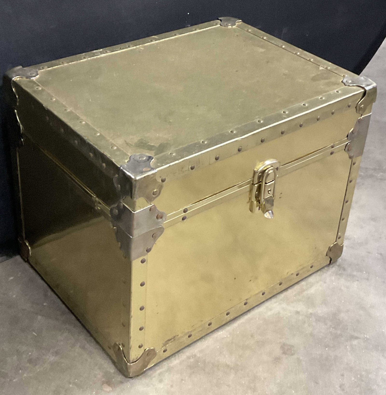 Gold Tone Metal Covered Wooden Chest: A gold tone metal covered wooden chest. Opens with hinge hardware. Measures approx. 14H x 14W x 18.5W in. Surface wear consistent with age, use, and exposure. home decor, home accents, homewares, hous