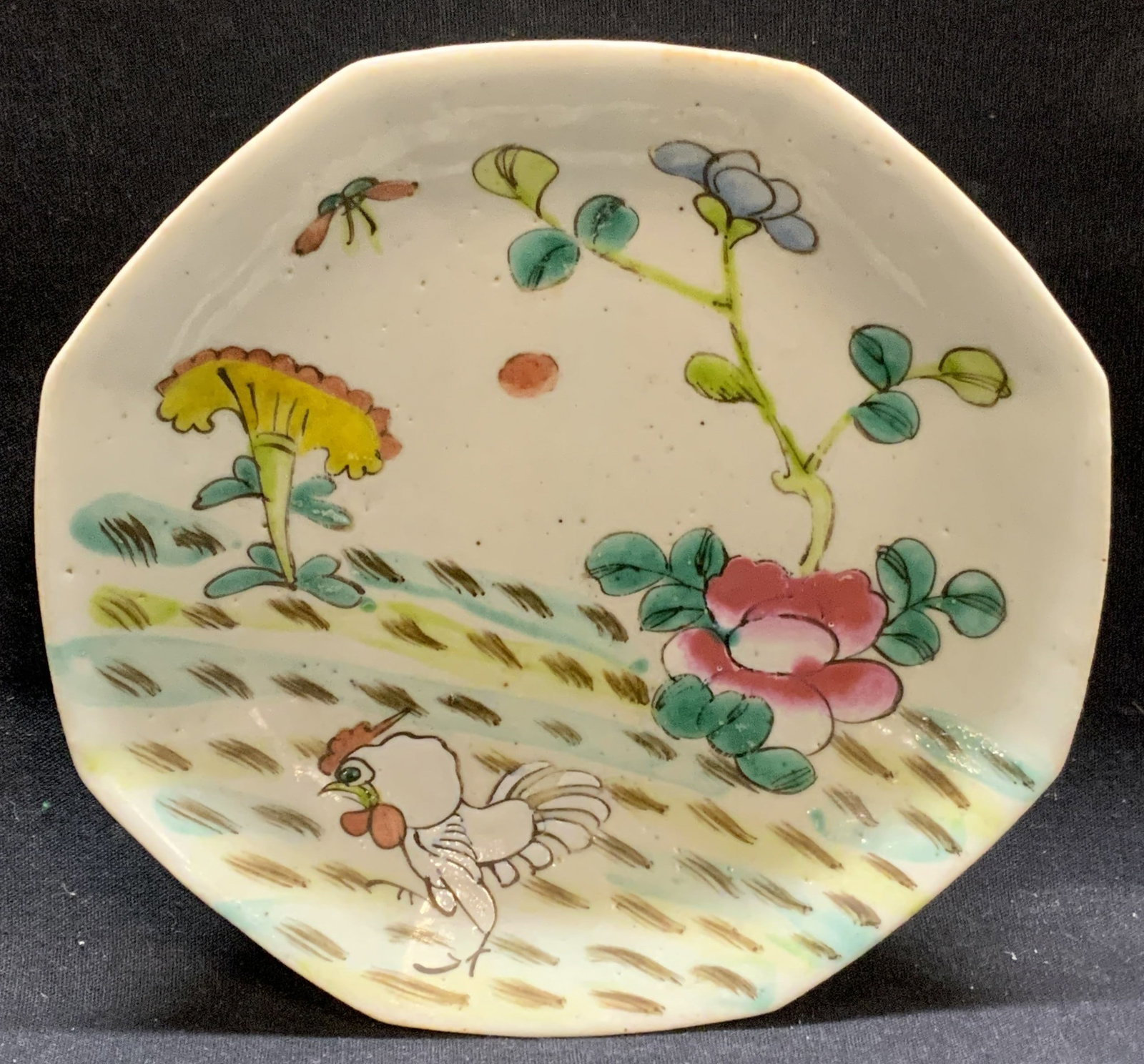 Vintage Octagonal Asian Porcelain Rooster Dish: Vintage octagonal shaped Asian porcelain dish with rooster and floral motif. Hand painted. Marked to underside, illegible. Measures approx. 6.5 inches diameter. Some surface wear including loss to pai