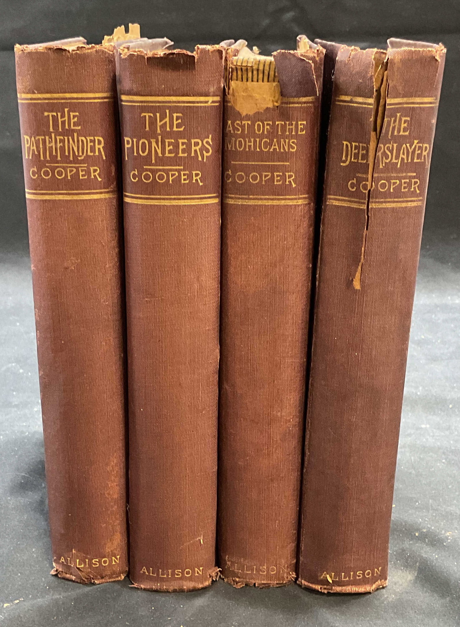 Set 4 Antique J Fenimore Cooper Books: Set of 4 hardcover J. Fenimore Cooper books published by William L. Allison company. No dates, circa late 19th century. Includes The Pathfinder, The Pioneers, The Last of The Mohicans, and The Deersla