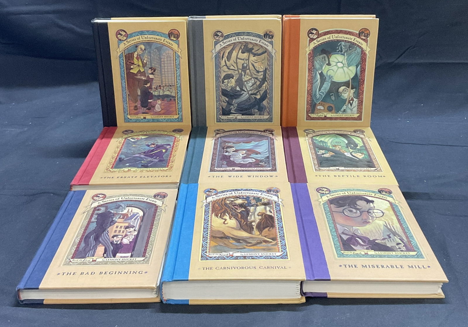 Set 9 A SERIES OF UNFORTUNATE EVENTS Ilst Books: A SERIES OF UNFORTUNATE EVENTS Books 1 though 9. Written by Lemony Snicket. Illustrations by Brett Helquist. Published by Harper Collins. C. 1999 to 2002. First Editions. Some writing to interior, dis