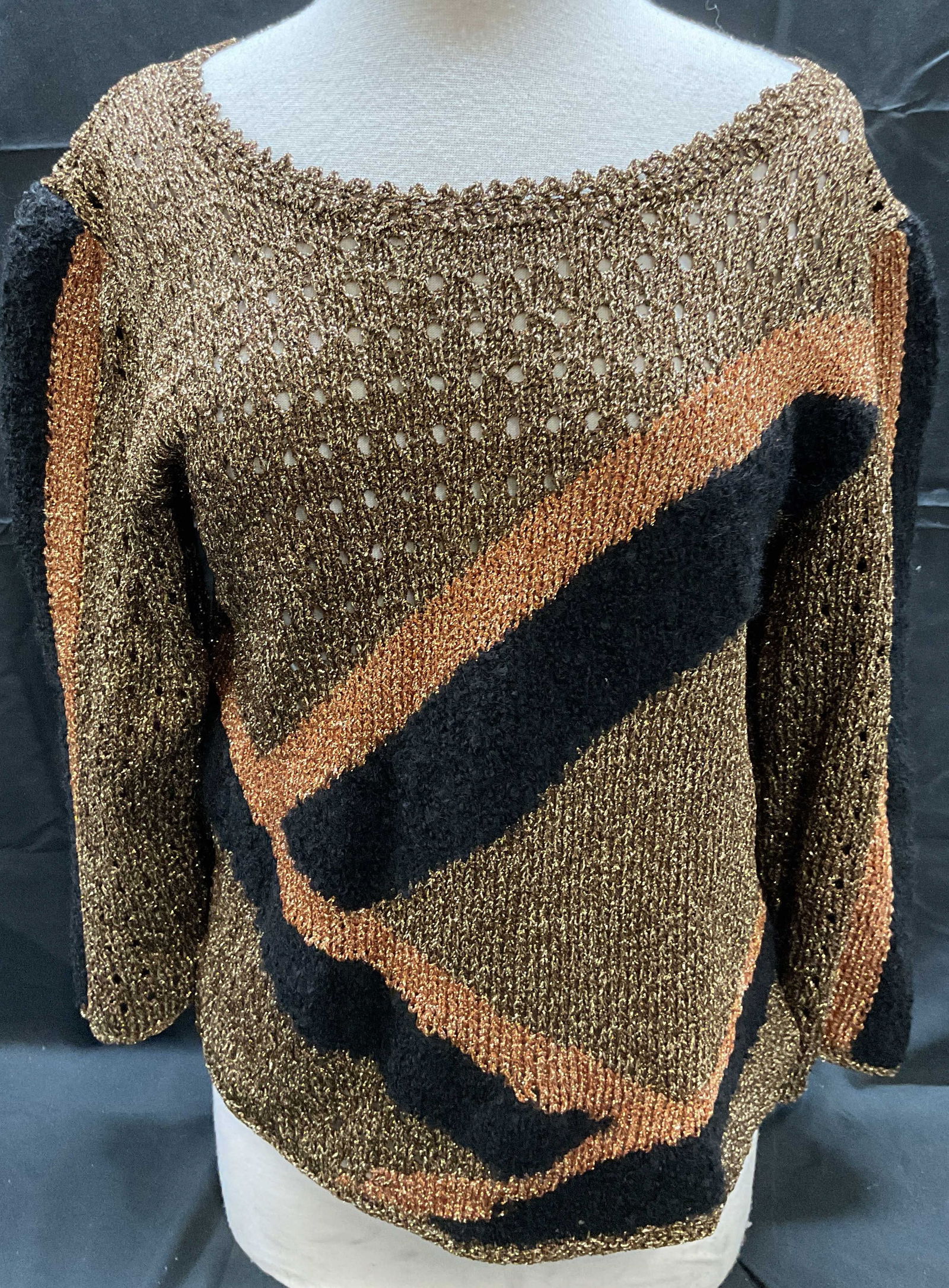 Vintage Metallic Gold Knit Sweater: Vintage knit sweater with metallic gold thread and abstract pattern. Material feels synthetic. Measures approx. 19 inches across chest. Some wear to material consistent with exposure. Ladies vintage s