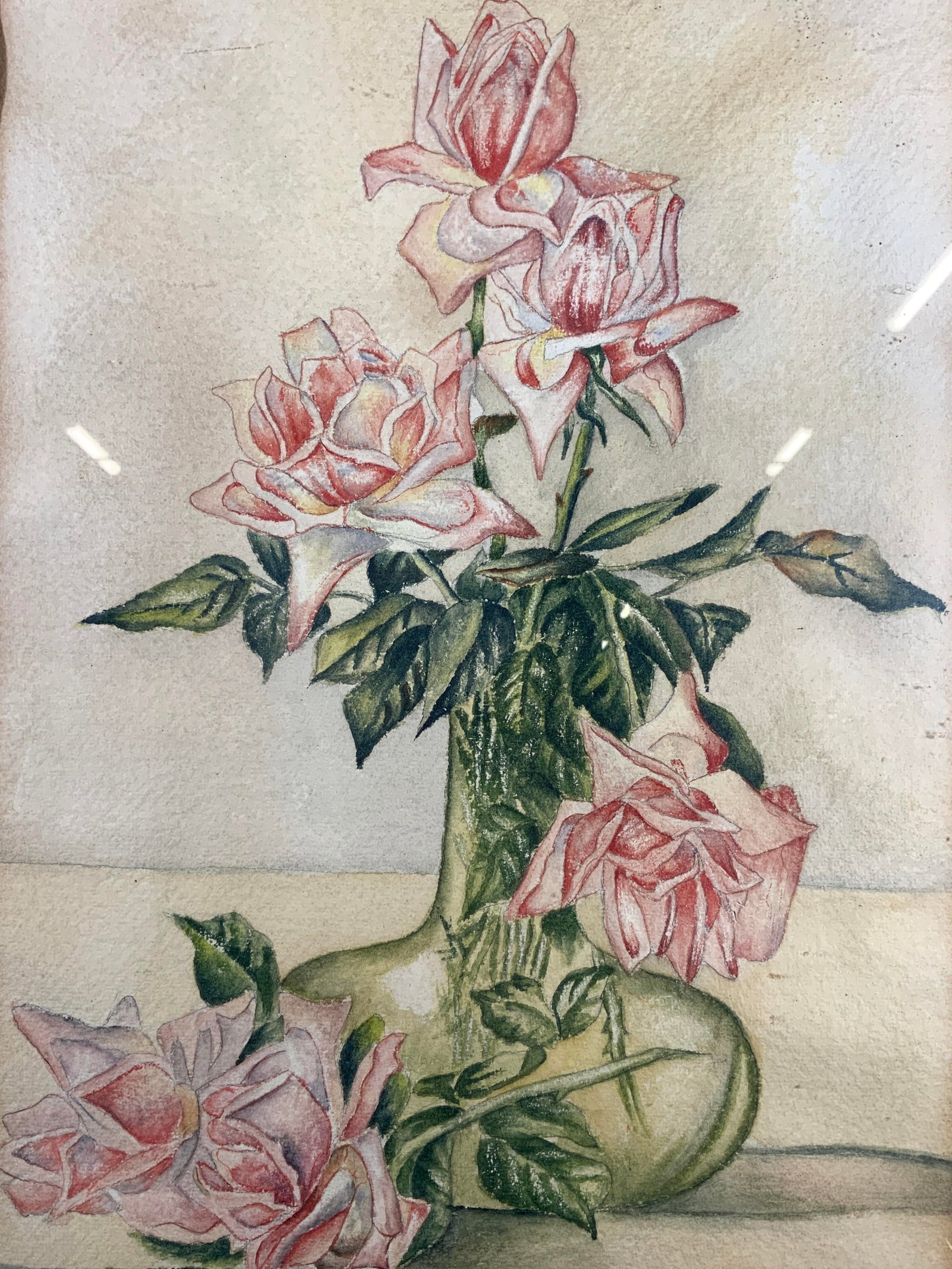 Framed Roses in Vase Still Life Watercolor: Watercolor on paper. Subject depicts a still life of roses in a water vase. Framed in a brown wooden frame. Frame measures approx. 21.5 W x 28 H in. Window measures approx. 18.5 W x 25 H in. Not viewe