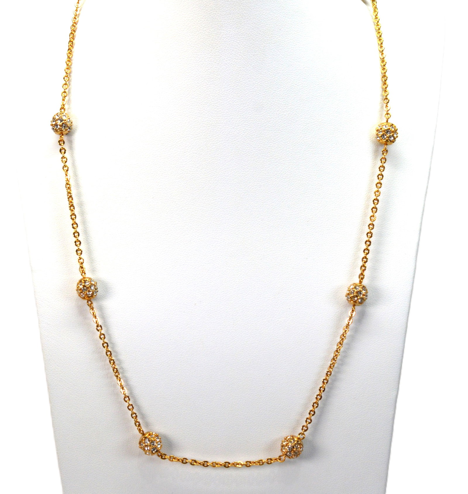 Nolan Miller Gold Tone Station Necklace: Fancy crystal studded beads adorn this adjustable gold tone necklace by Nolan Miller.PREOWNEDBS18 J