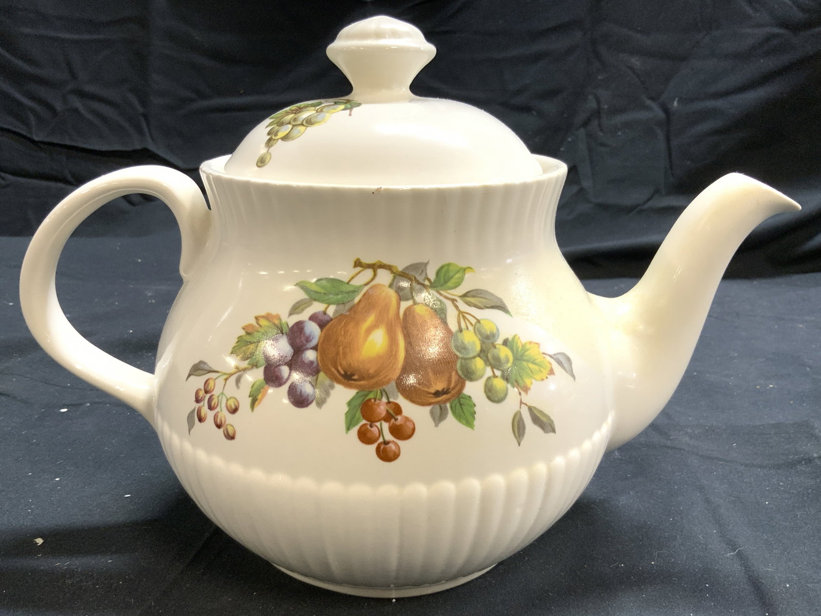 WICKLOW VALE Vntg Porcelain Teapot W Lid: Underside and tag reads WICKLOW VALE IRELAND. Piece is white toned and porcelain with multi toned fruit and leaf detail. Teapot includes lid. Piece appears to be Vintage. Teapot measures approximately