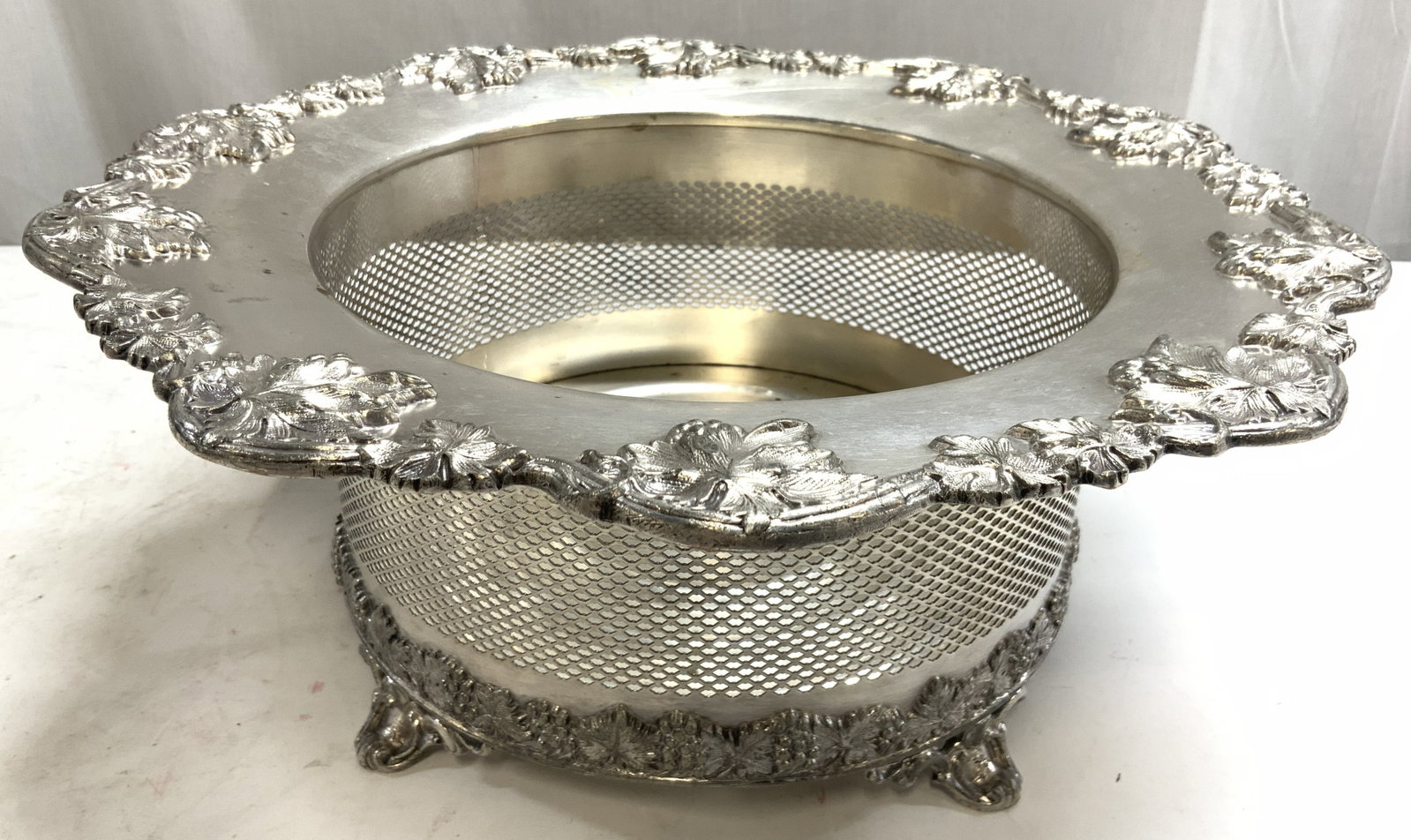 English Silver Plate Barware Tableware Wine Cooler: Wine Cooler appears to be silver plated. Underside is inscribed HBEP 8376. English Barware tableware wine cooler. Piece has 4 scrolled feet. Vessel has beveled vine & leaf detail to rim. Piece has pie