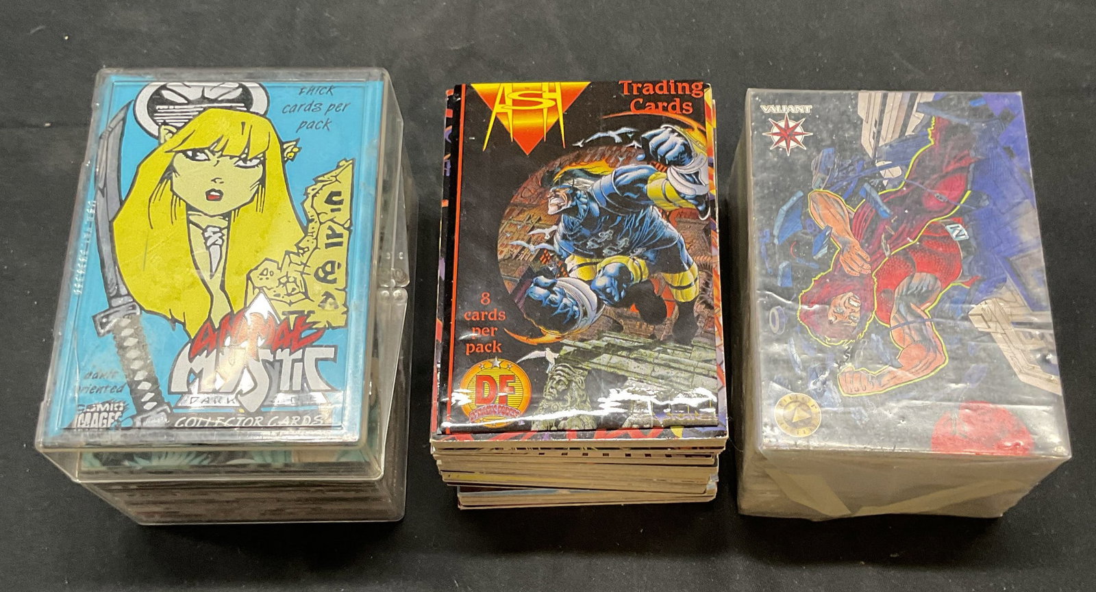 Group Lot Valiant Era II, Ash + Trading Cards: Group lot of 100+ pieces vintage trading cards. Includes sets of Valiant Era II, Ash Dynamic Force, and Animal Mystic. Cards measure approx. 3.5 x 2.5 inches each. Cards not inspected individually. Al