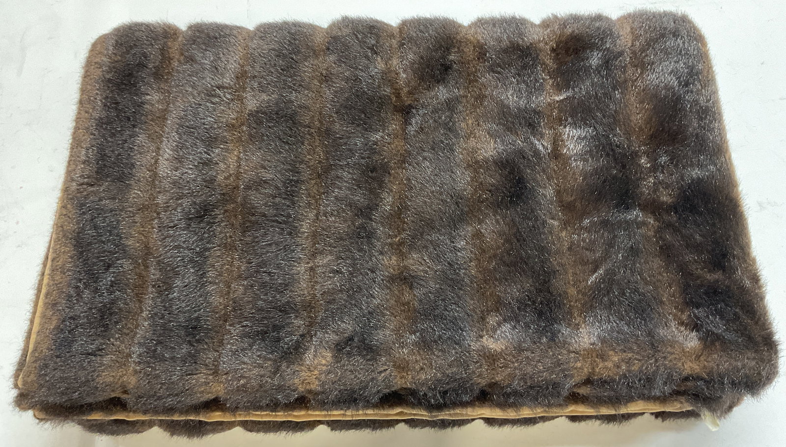 Legacy Brown Faux Fur Blanket: Legacy brown faux fur blanket. Cotton lining. Olefin blend. Measures approx. 68 x 52 inches. Some wear to material including blemishes observed. Legacy blanket, faux fur blanket, brown faux fur blanke
