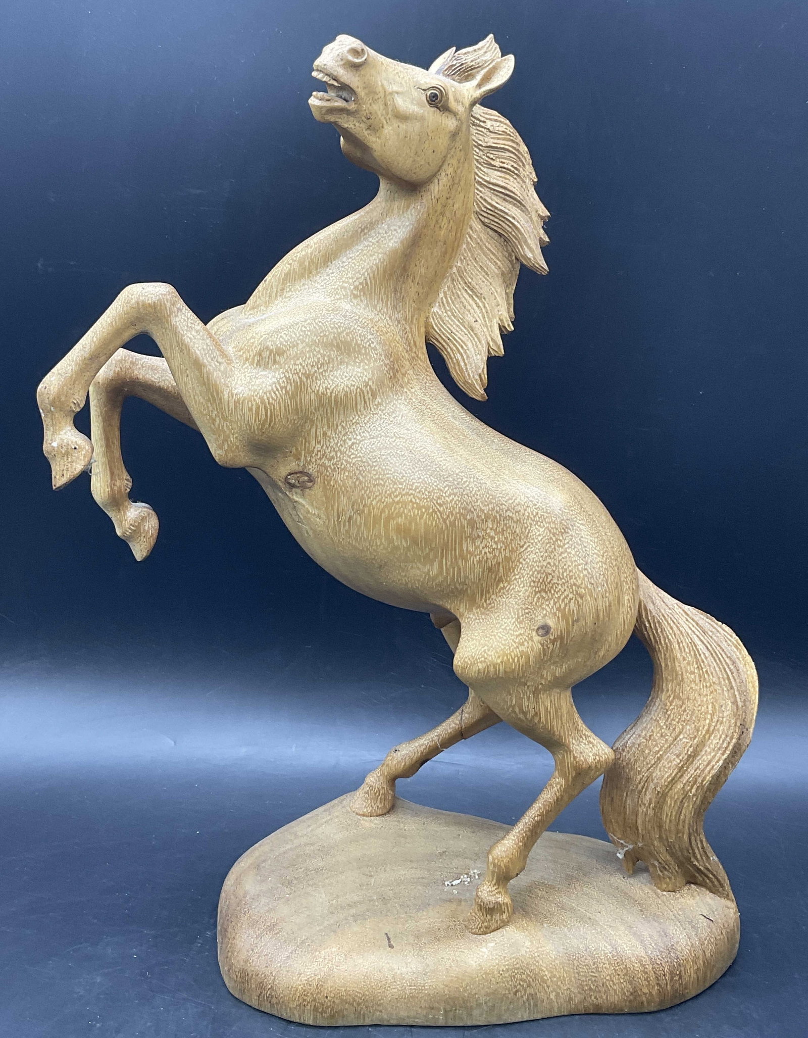 Carved Wood Horse Figural: A carved wood horse figural. Crafted from light hued wood. Measures approx. 15.5H x 9.25W in. Measured at base. Cracking and surface wear present. home decor, home accents, homewares, housewares, home