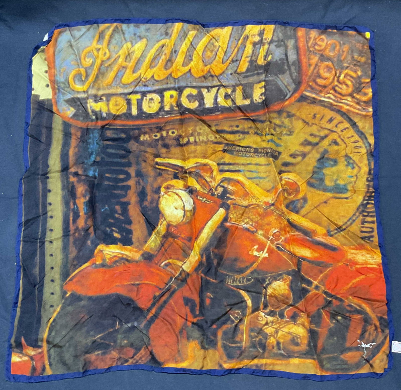 Signed Silk Graphic Print Motorcycle Scarf Italy: Signed silk scarf with graphic print motorcycle motif. Signed on corner and label with dragonfly mark. Made in Italy. Measures approx. 21 x 21 inches. Some wear to material consistent with exposure. L