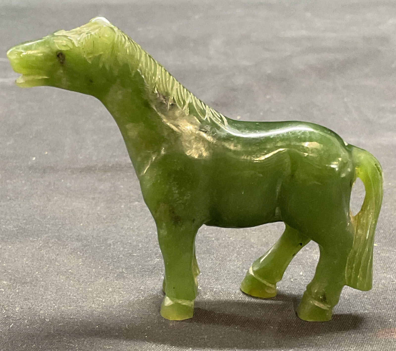 Vintage Hand Carved Jade Horse Figural: Vintage hand carved jade horse motif figural. Measures approx. 3.5 x .75 x 2.75 inches. Some surface wear including scratching observed. Horse figural, Jade figural, Jade horse, collectibles, decorati