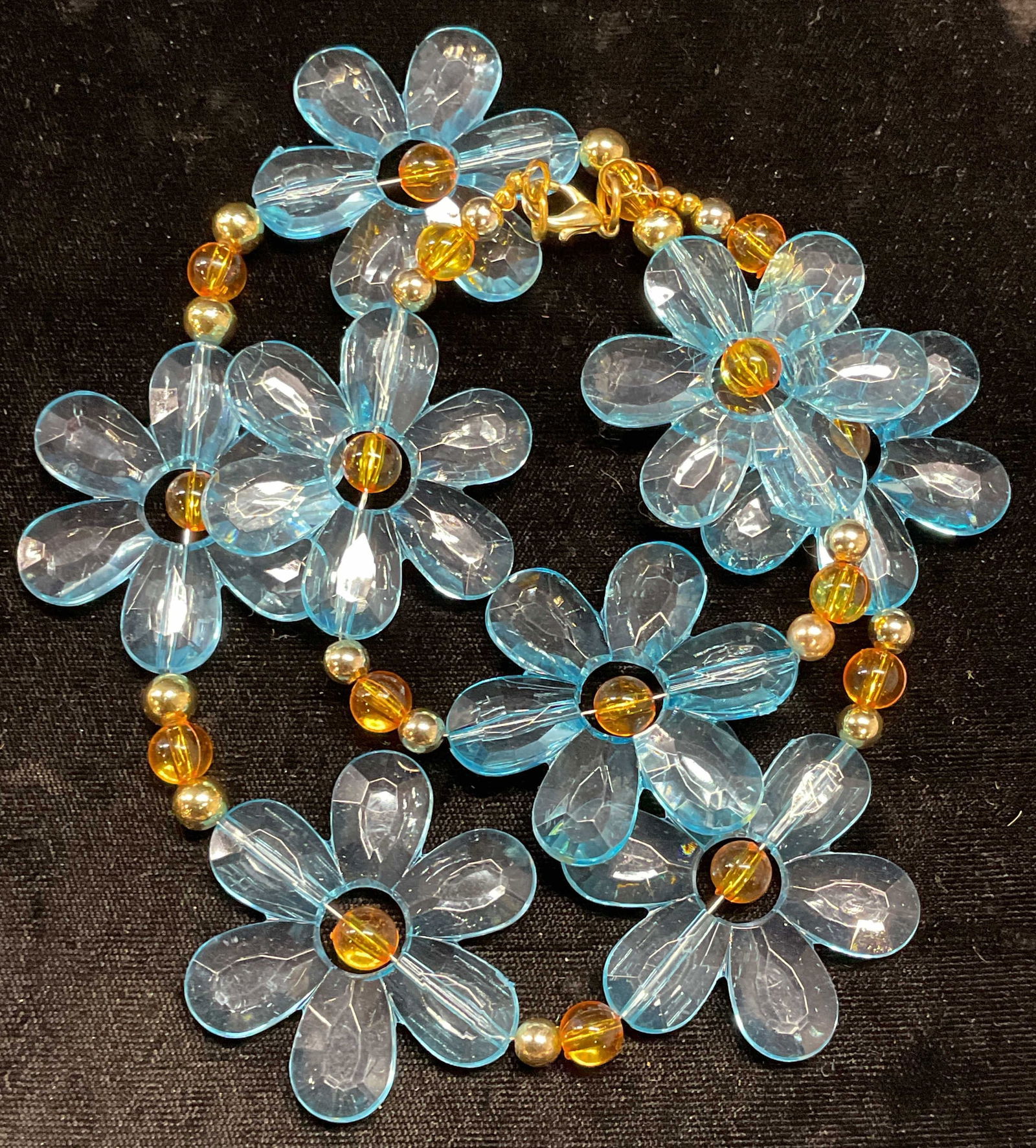 Vintage Blue Crystal Flower Necklace: Vintage blue crystal flower motif beaded necklace with gold tone accent beads. Drop length approx. 10.5 inches. Some surface wear including scratching observed. Jewelry, estate jewelry, costume jewelr
