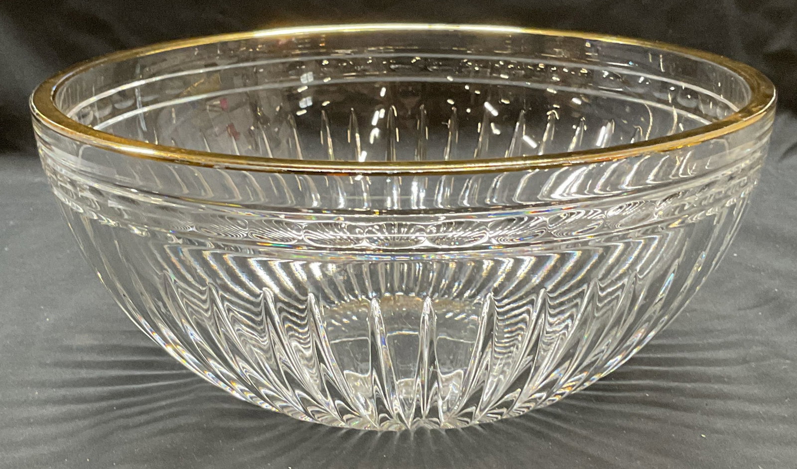 Marquis by Waterford Gilt Cut Crystal Bowl: Marquis by Waterford Hanover bowl. Cut crystal with line and ribbed design and gilt rim. Signed on underside. Thick walled crystal, piece has weight. Measures approx. 10 x 4.75 inches. Some surface we