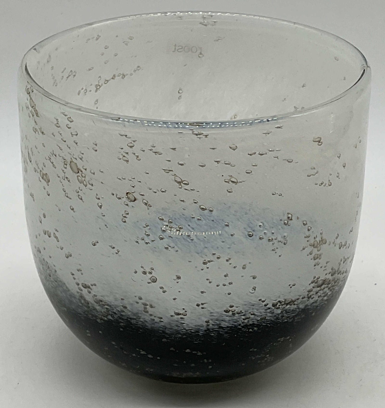 Roost White to Black Bubble Candle Holder: Roost white to black bubble glass bowl candle holder. Signed on label and underside. Measures approx. 5 x 4.75 inches. Some surface wear consistent with exposure. Roost candle holder, art glass candle