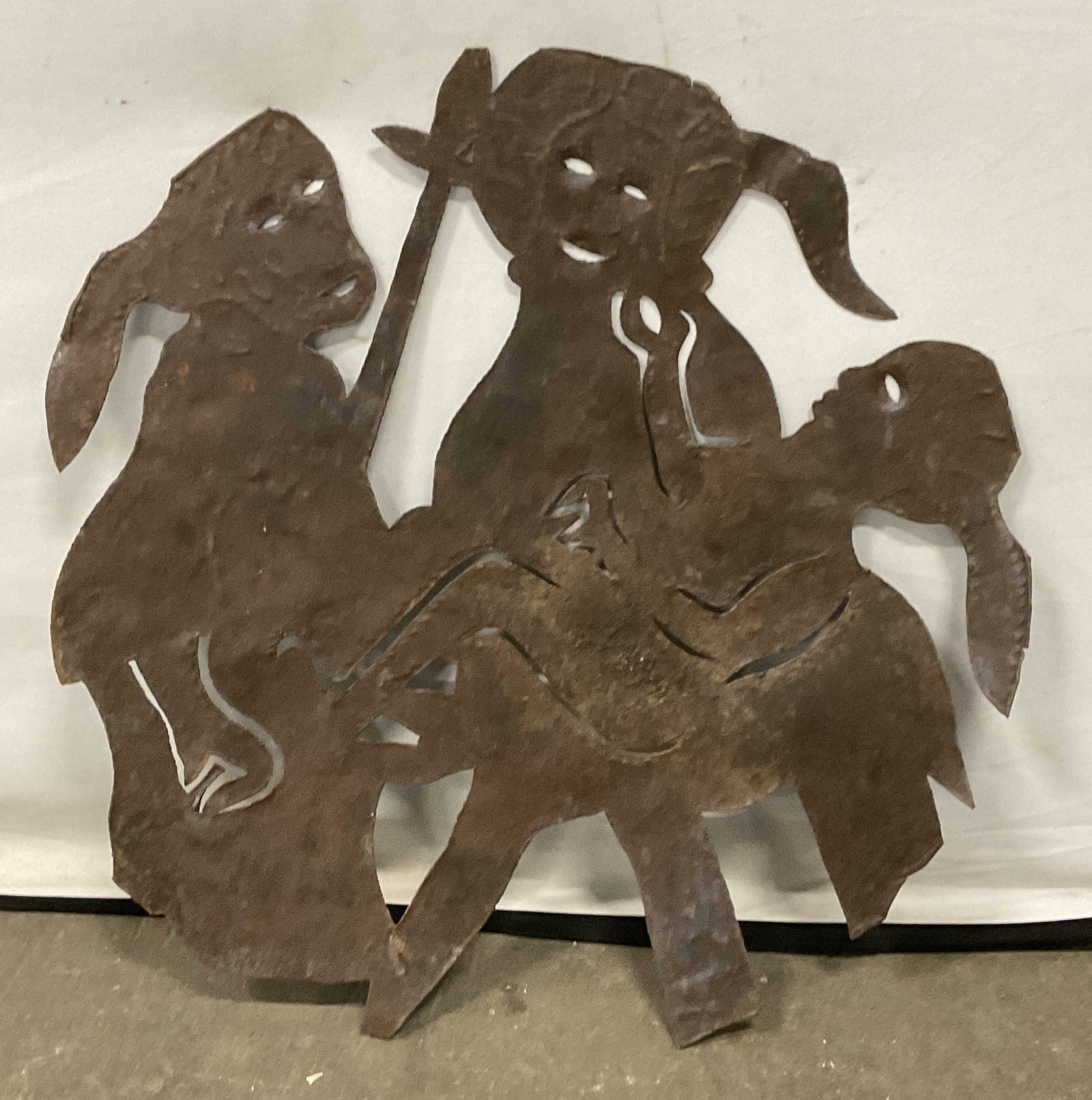 Vintage Cut Metal Figural Motif Wall Panel: Vintage Cut Metal Figural Motif Wall Panel. Three figures depicted. Possibly iron. Measures approx. 23.25W x 23.5L in. Discoloration, losses, chipping, warping, and surface wear present. home decor, h