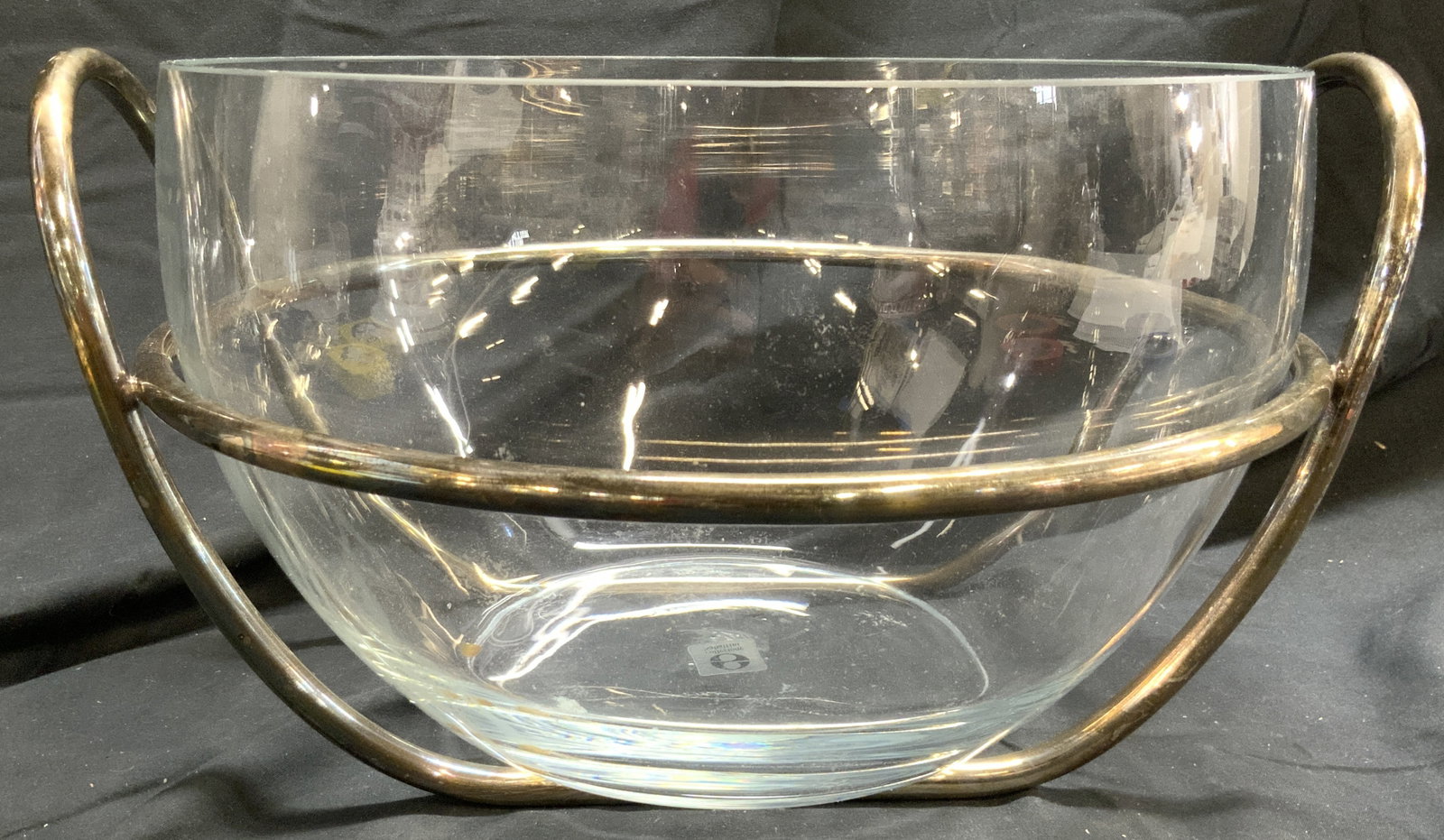 COLLEZIONE SABATINI Gls Bowl W Silver Plate Holder: Underside reads COLLEZIONE SABATINI. Bowl is glass. Piece has silver plate holder with handles. Art glass bowl with silver plate holder. Piece measures approximately 14 inches wide 7.5 inches tall. Bo