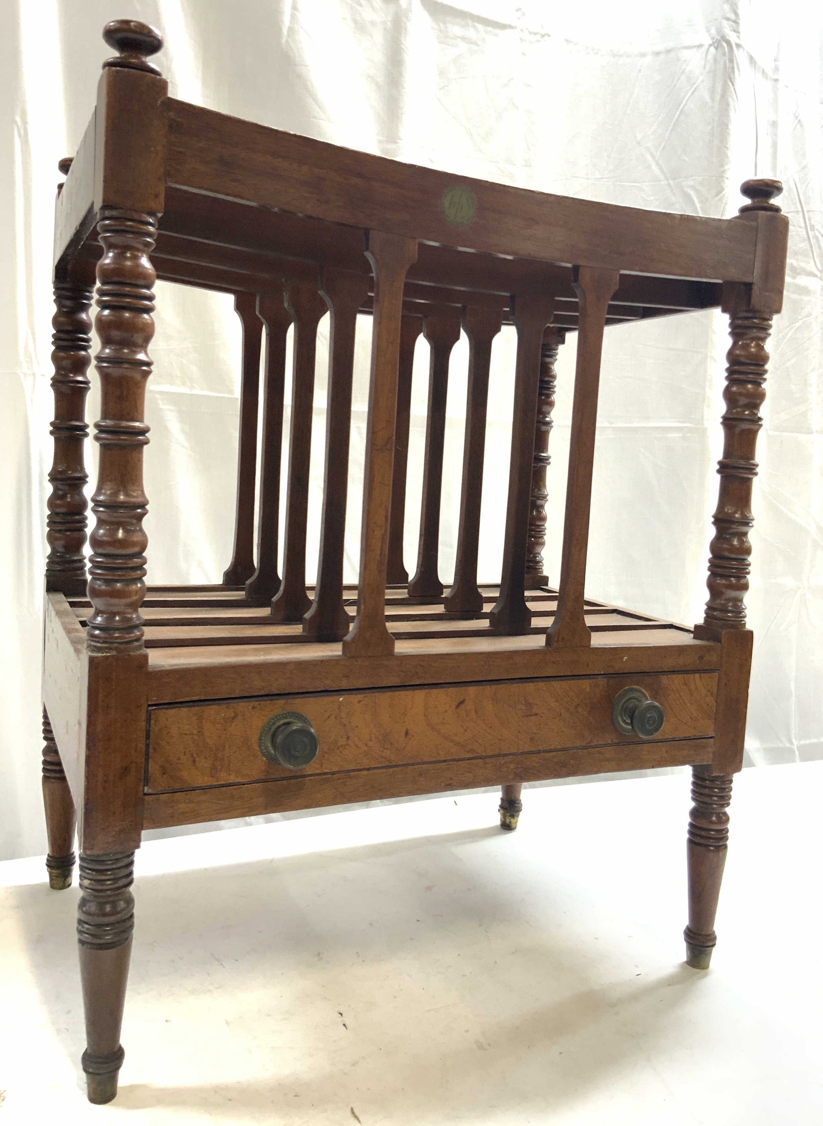 Vintage English Wooden Canterbury W Drawer: Canterbury is brown toned and wooden. Piece has 1 drawer with 2 gilt metal knob style drawers pulls. Canterbury has 4 carved wooden legs. Piece is vintage. Canterbury measures approximately 18 inches 