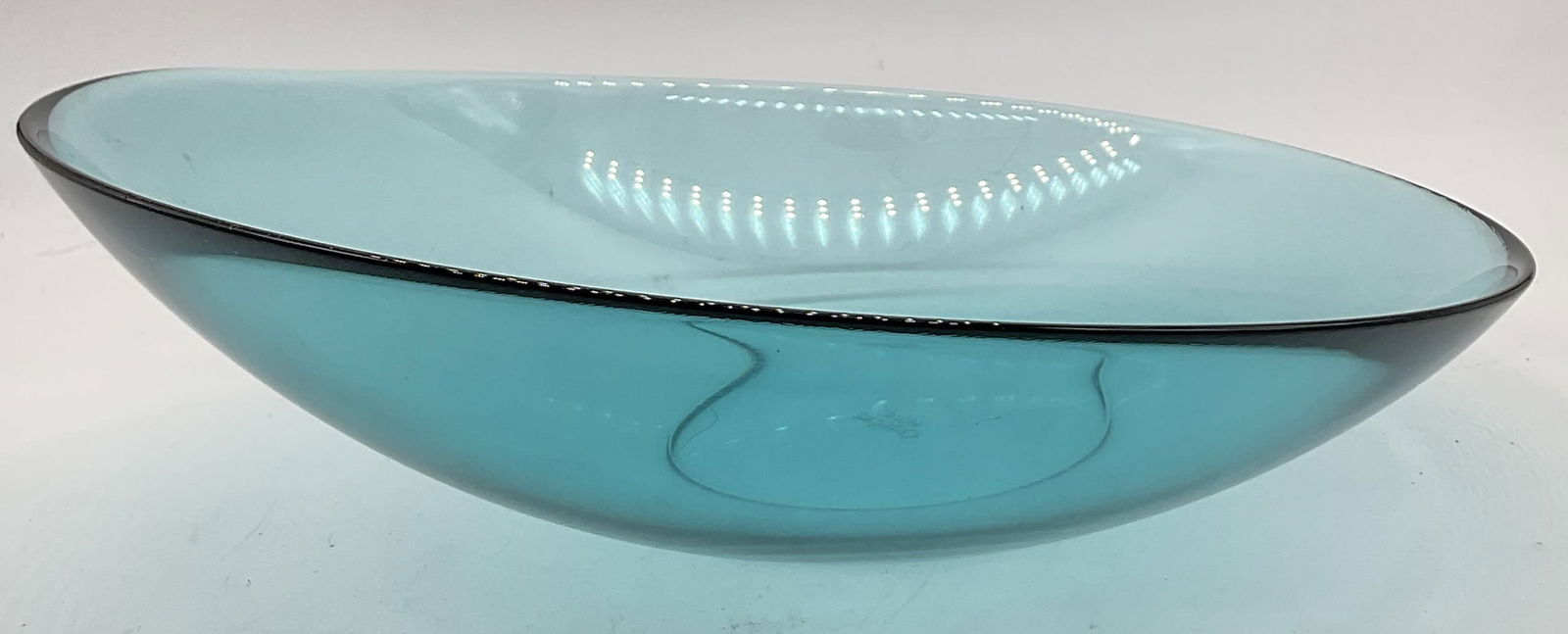 ORREFORS HOME Blue Crystal Asymmetrical Bowl: ORREFORS HOME Blue Crystal Asymmetrical Bowl. Tilted asymmetrical form. Underside signed ORREFORS HOME. Measures approx. 3.25H x 10.25W in. Surface wear consistent with age, use, and exposure. home de