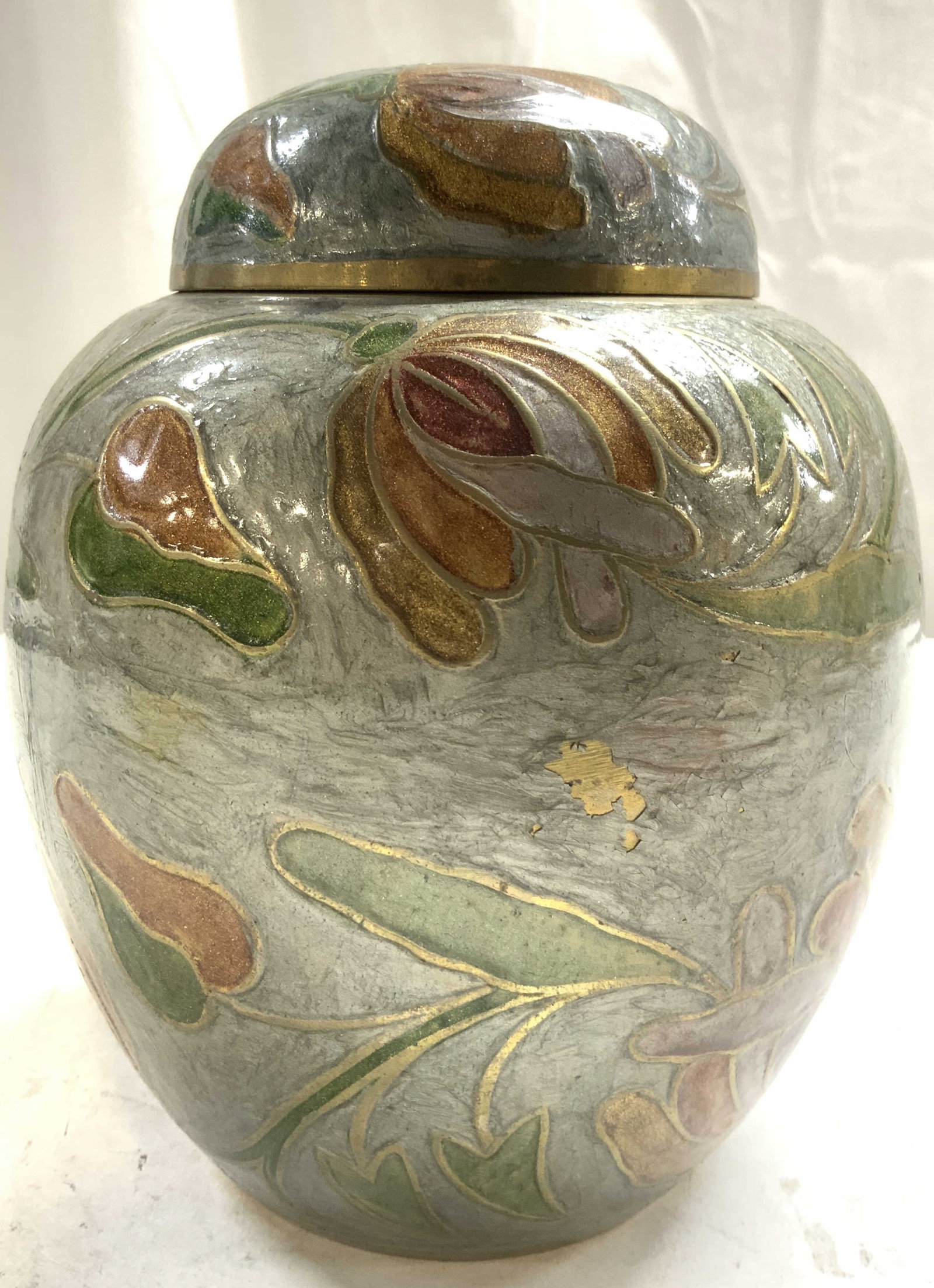 Vntg Asian Enamel Urn W Floral Detail & Lid: Urn is vintage. Piece is enameled with multi toned floral and leaf detail. Urn includes lid. Interior is gold toned, possibly brass. Vessel with lid measures approximately 7 inches tall 5.5 inches wid