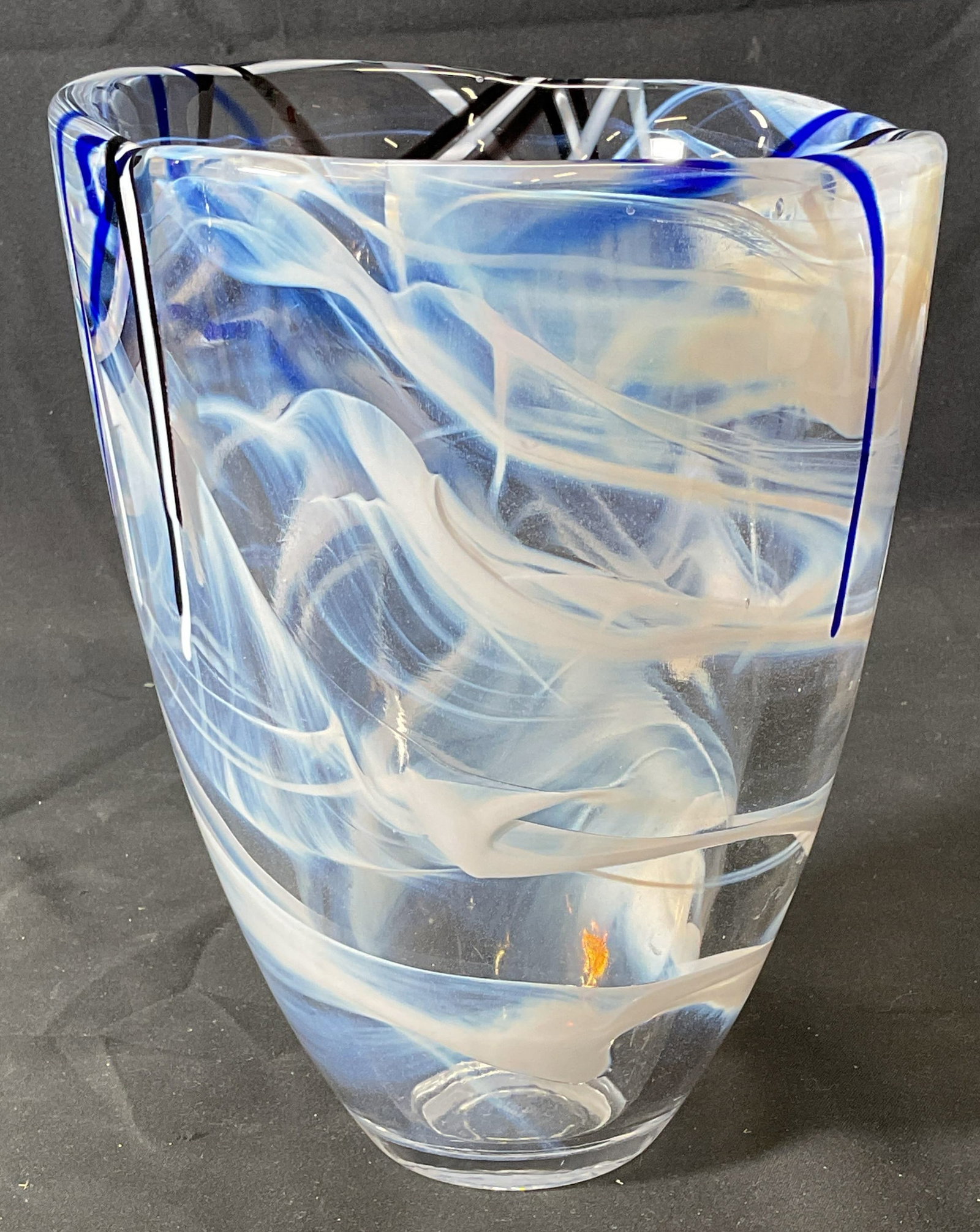 Kosta Boda Blue White Swirl Art Glass Vase: Kosta Boda art glass vase. Blue and white swirl. Signed on underside. Measures approx. 5.75 x 7.75 inches. Thick walled glass, piece has weight. Some surface wear including minor scratching observed. 