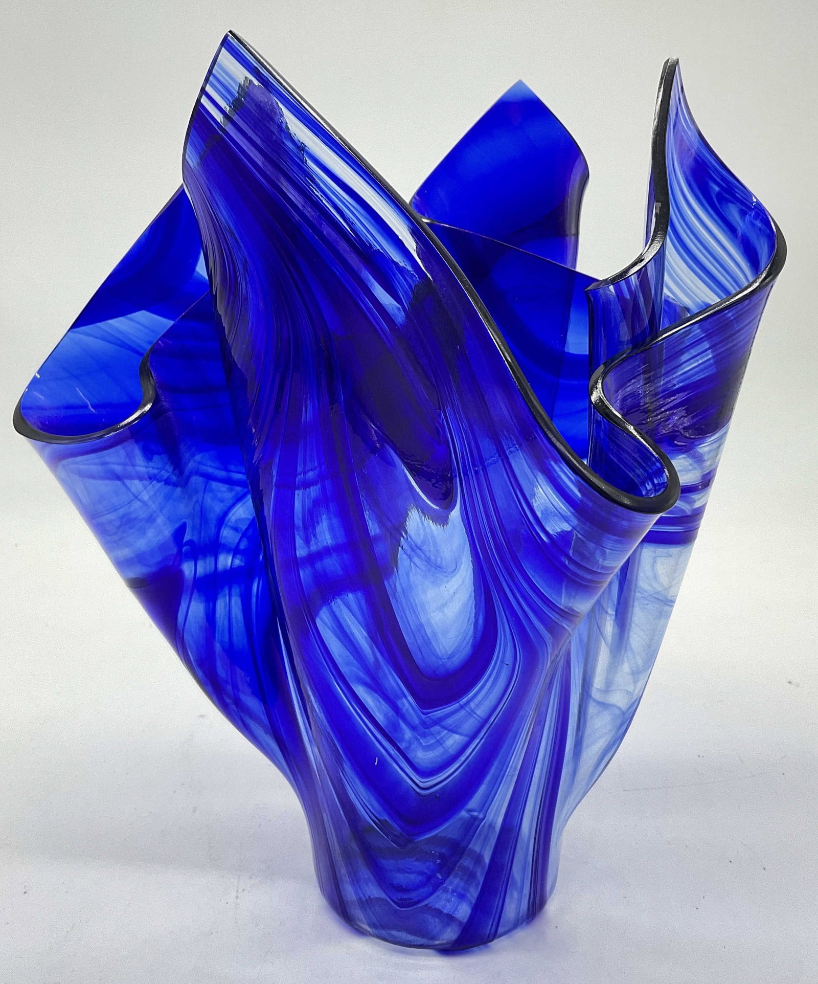 MKG Signed Blue Art Glass Handkerchief Vase: MKG Signed Swirled Blue Art Glass Handkerchief Vase. Ruffled / handkerchief rim. Measures approx. 9.25H x 6.5W in. Underside signed MKG. Surface wear consistent age, use, and exposure. home decor, hom