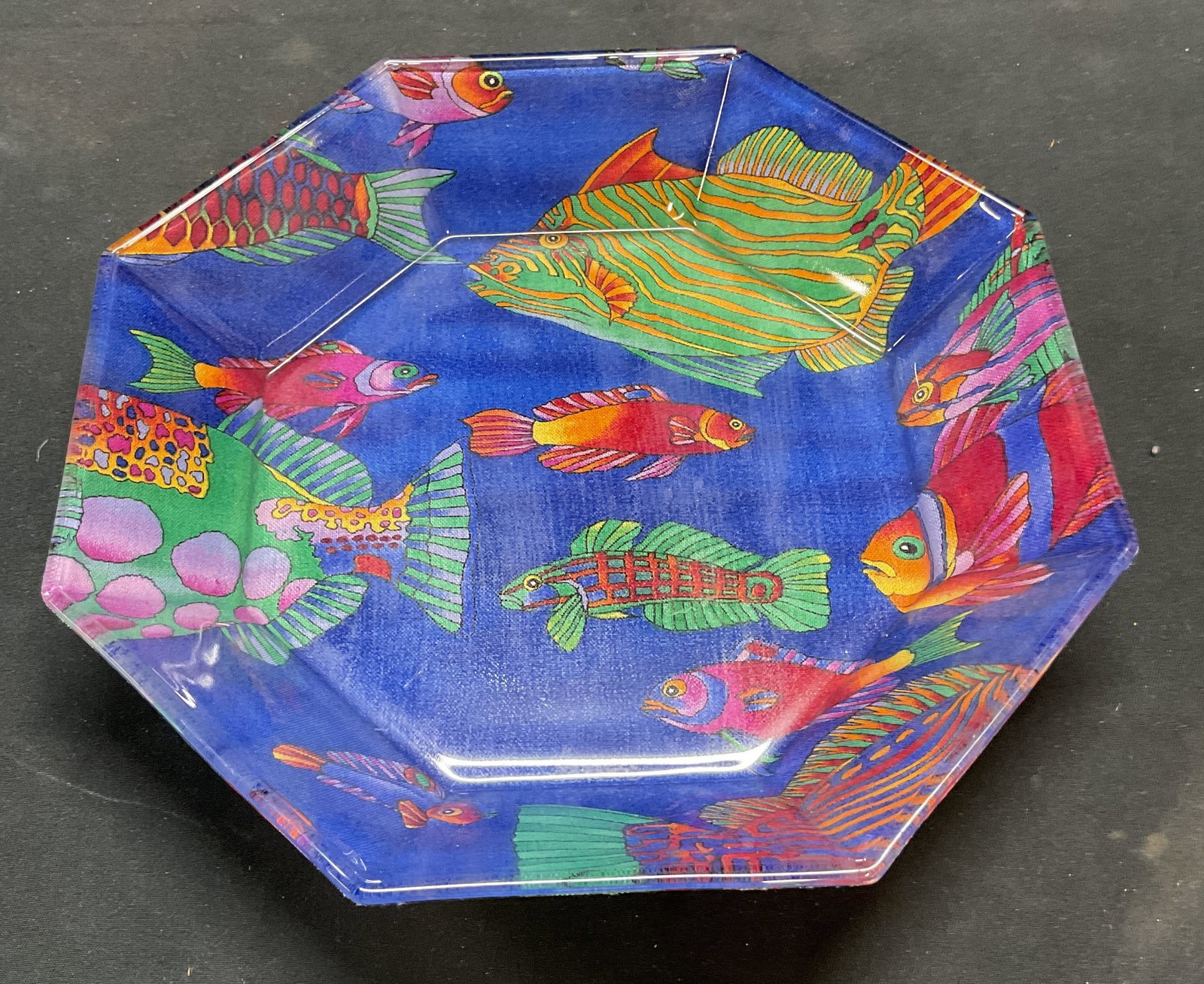 Signed ARCOROC Glass Fish Octagon Bowl: Inverted ARCOROC hallmark, glass bowl with fish pattern decoupage in blue, green, and red. Signed on base. Hand signed on underside, partially legible reads Mama. Octagon shaped. Measures approx. 7.5 