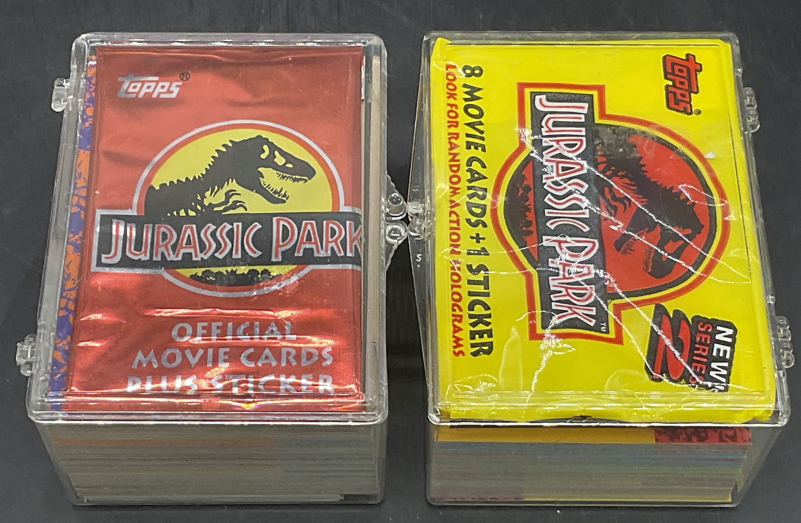 Grp TOPPS Jurassic Park Collectible Trading Cards: Group lot of TOPPS Jurassic Park collectible trading cards. Cards are contained in hard plastic cases measuring approx. 2H x 2.75W x 3.75L in. Some card packaging comes with the cards. Some cards are