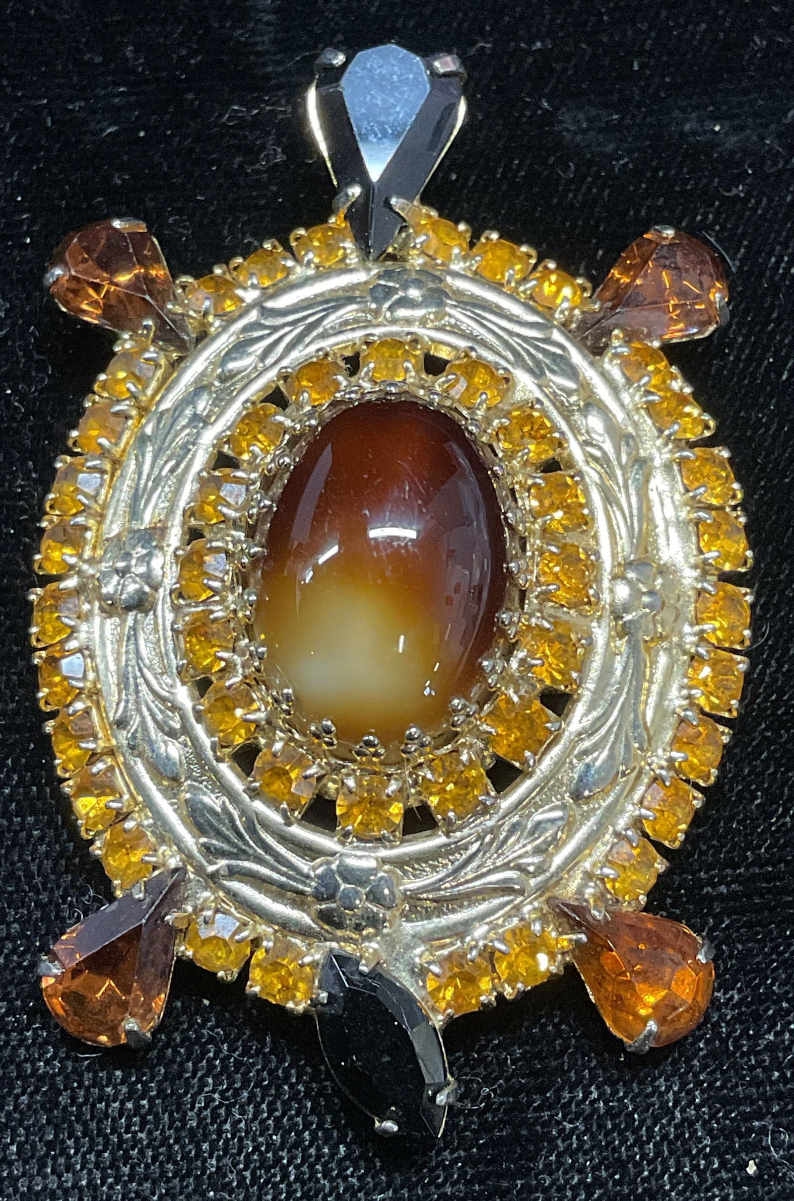 Gold Tone Crystal Lucite Turtle Pendant: Gold tone turtle motif pendant with crystal and lucite cabochon decoration. Bail on underside. Measures approx. 2.25 x 1.5 inches. Some surface wear including scratching observed. Jewelry, estate jewe
