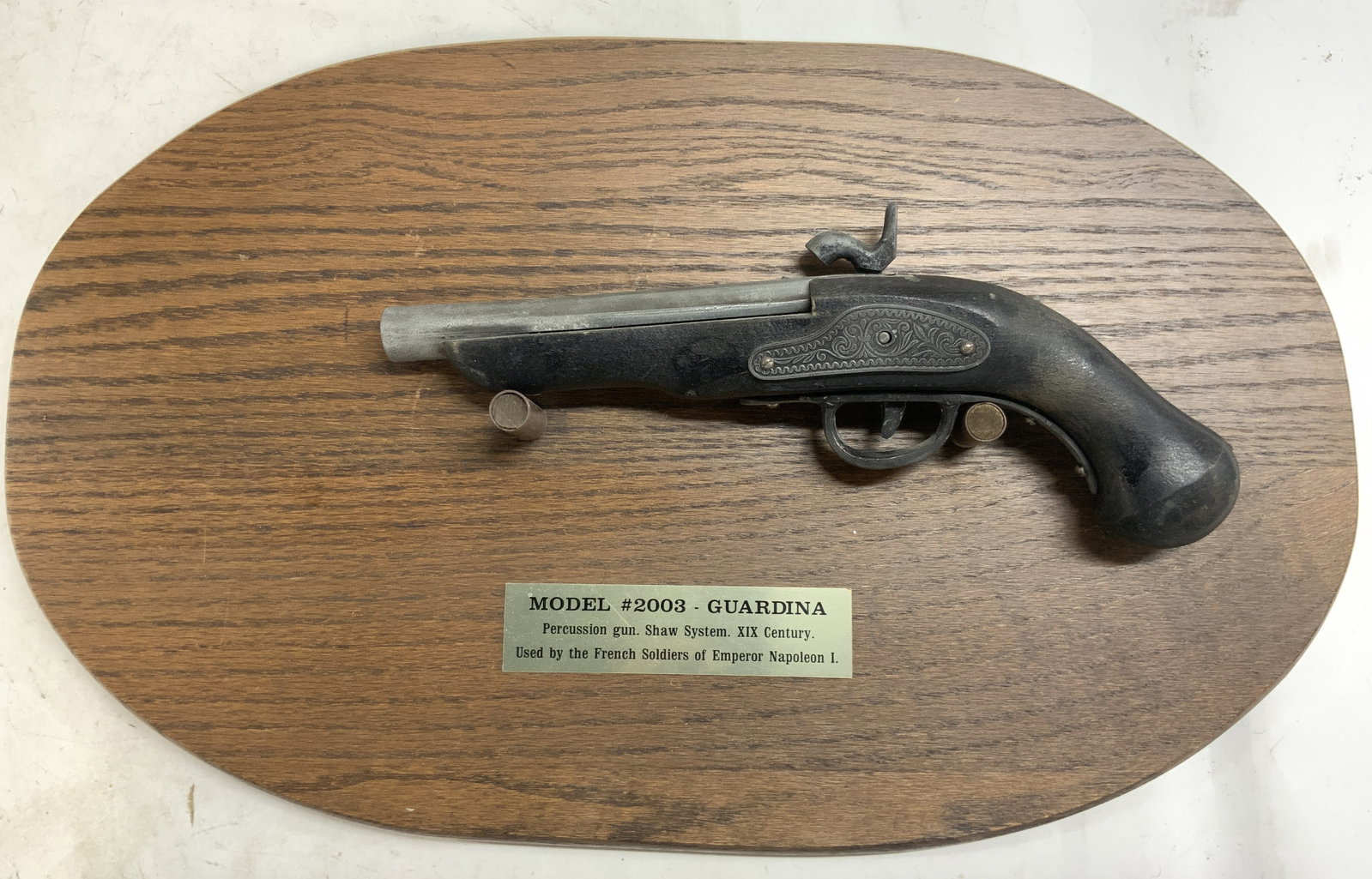 GUARDINA Gun Model Replica Of French 19 C Pistol: Plaque reads MODEL 2003 GUARDINA Percussion gun. Shaw system. XIX Century Used By The French Soldiers of Emperor Napoleon. Piece is black toned wood and metal. Replica is inscribed SPAIN. Replica pist