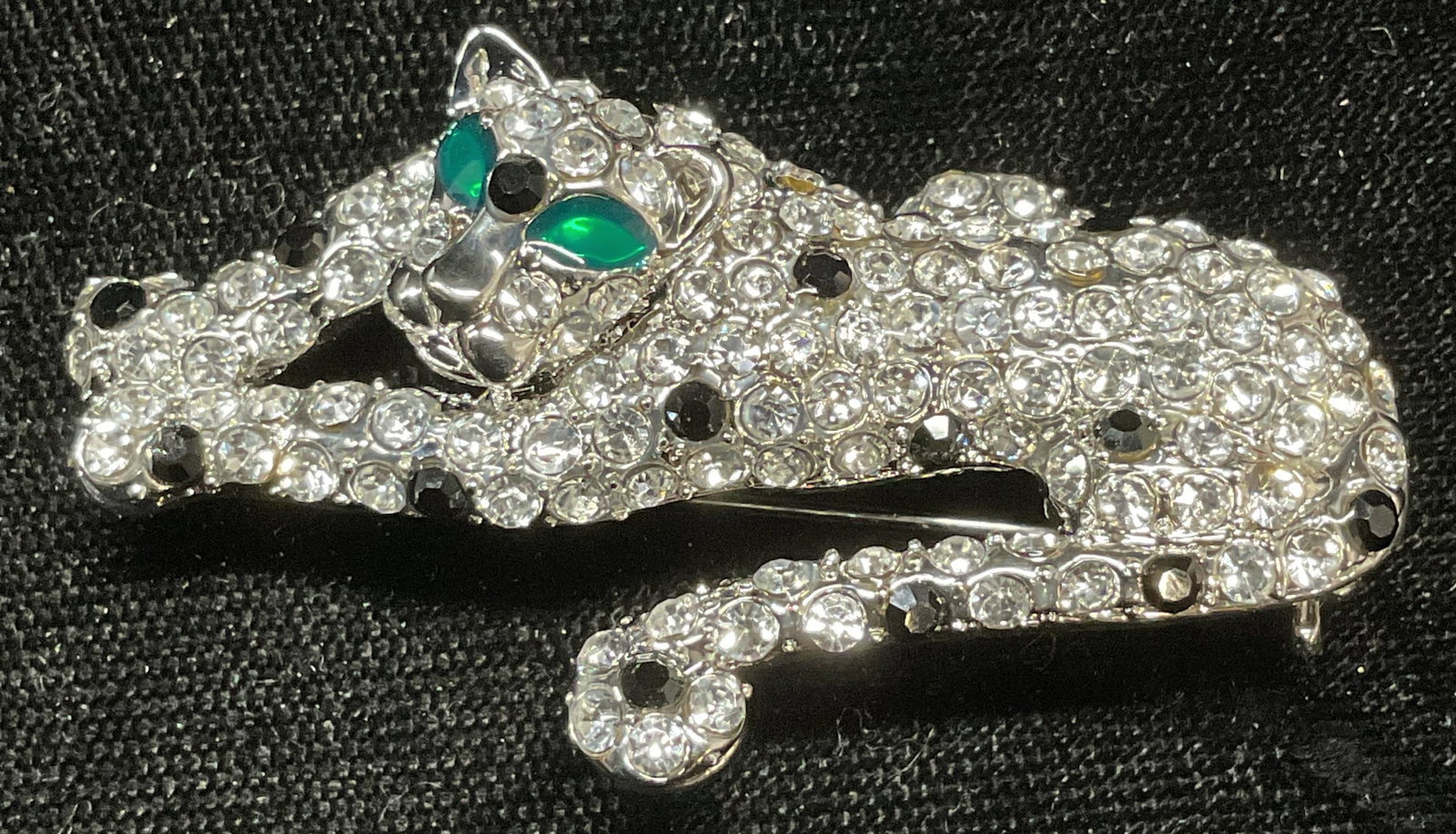 Ali Lang Silver Tone Crystal Panther Brooch: Ali Lang silver tone panther motif brooch with multicolor crystal decoration. Signed on underside. Hinge pin on underside. Measures approx. 1 x 2 inches. Some surface wear including scratching observe
