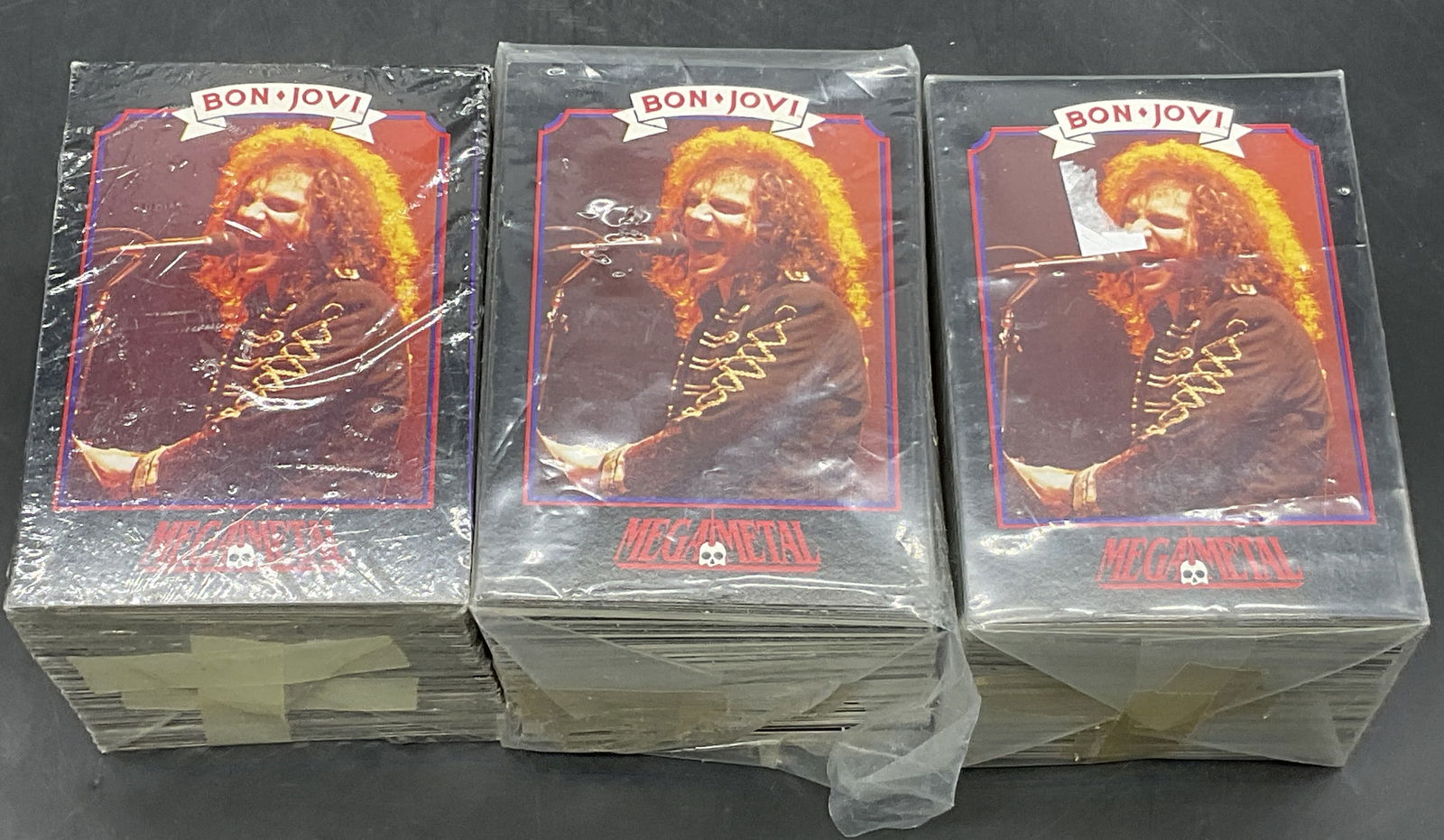 Grp Lot MEGAMETAL Collectible Trading Cards: A group lot of MEGAMETAL collectible trading cards. Cards are unexamined and contained in plastic packaging. Some losses to the packaging. Surface wear consistent with age, use, and exposure. Packages