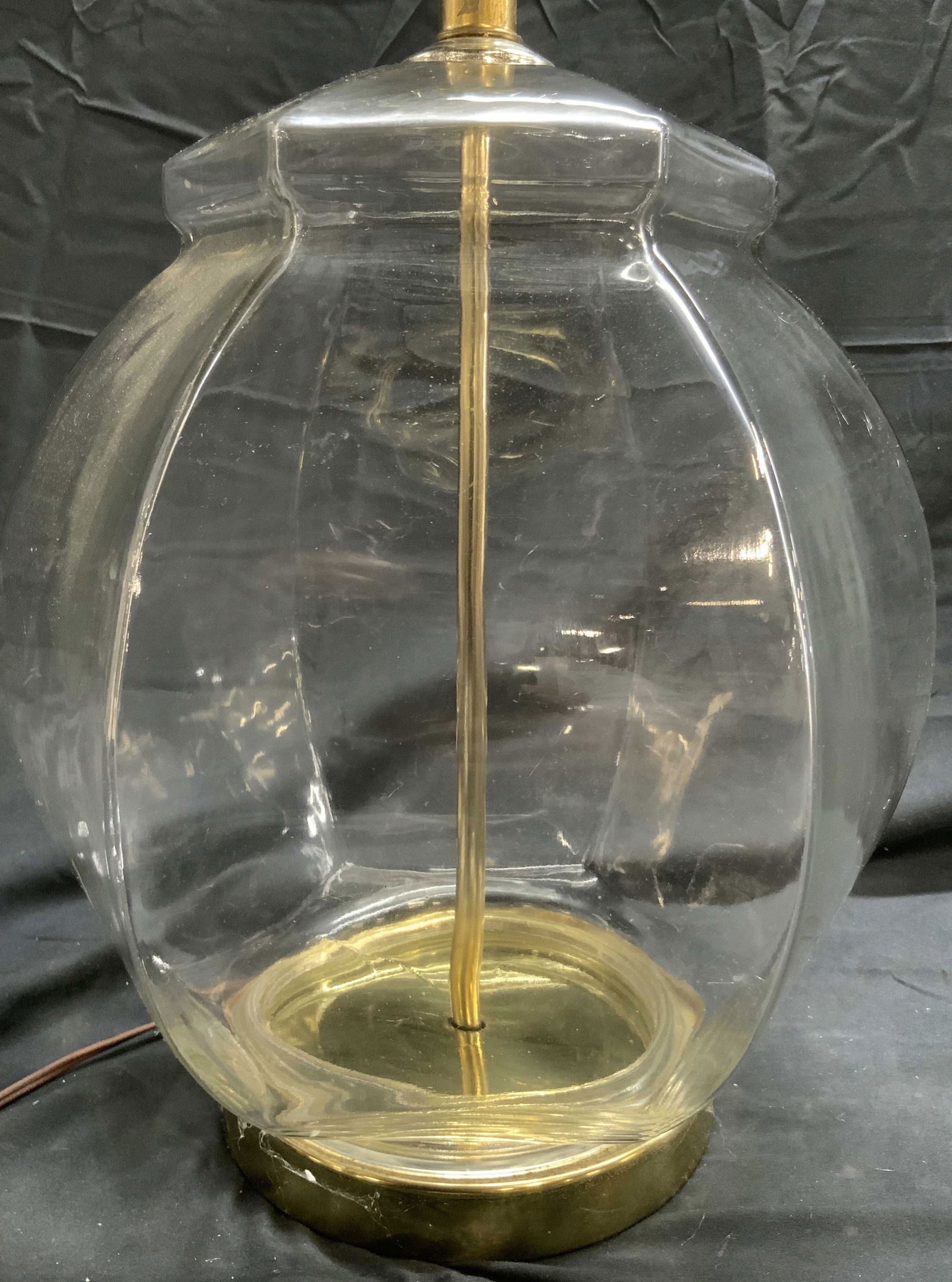 Glass Side Lamp W Gilt Metal Base: Lamp is glass with gold toned gilt metal base. Piece Includes harp & finial. Lamp has circular form finial. Piece measures approximately 28 inches tall 11 inches wide. Lamp, glass lamp, side table lam