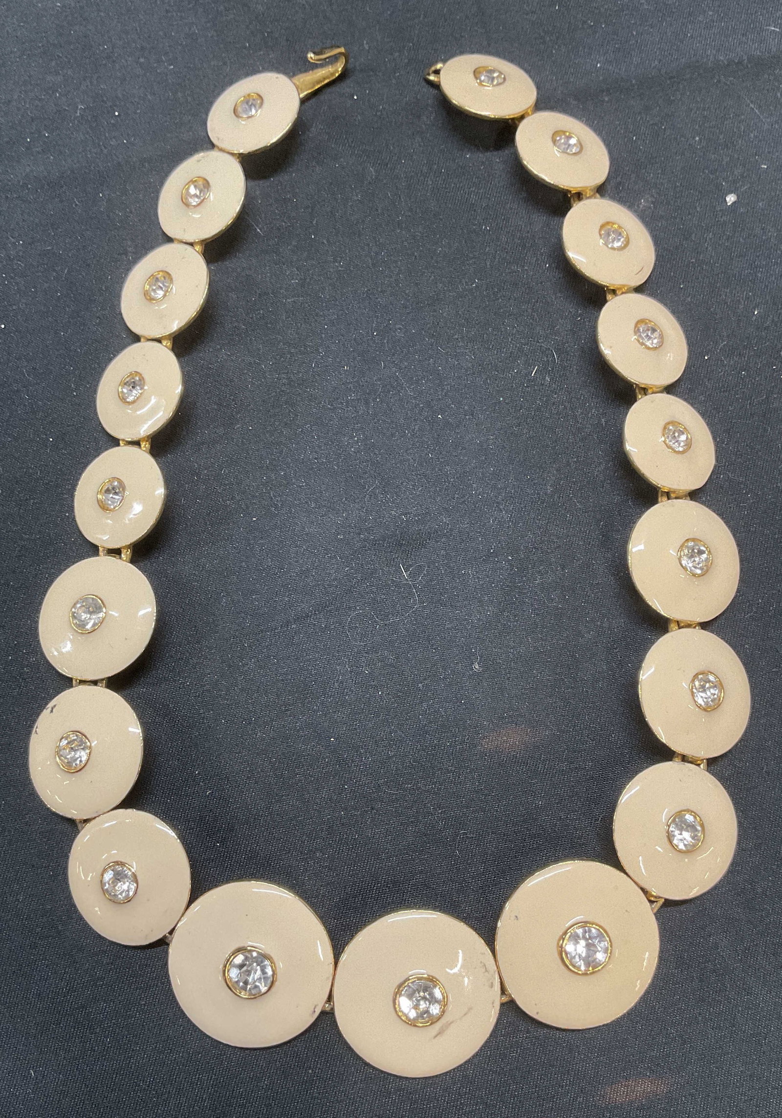 Vintage White Enamel Crystal Necklace: Vintage gold tone necklace with white enamel disc and colorless crystal decoration. Drop length approx. 6.5 inches. Some surface wear including scratching observed. Jewelry, estate jewelry, costume je