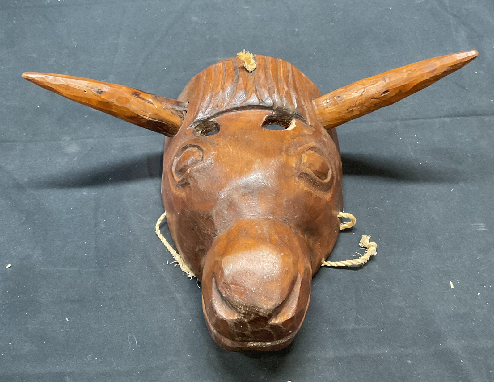 South American Carved Wood Horse Head Mask: South American carved wooden horse head motif mask. Measures approx. 8 x 12.5 x 4.5 inches. Some surface wear consistent with exposure. Horse head, carved wooden horse head, horse mask, wood mask, col